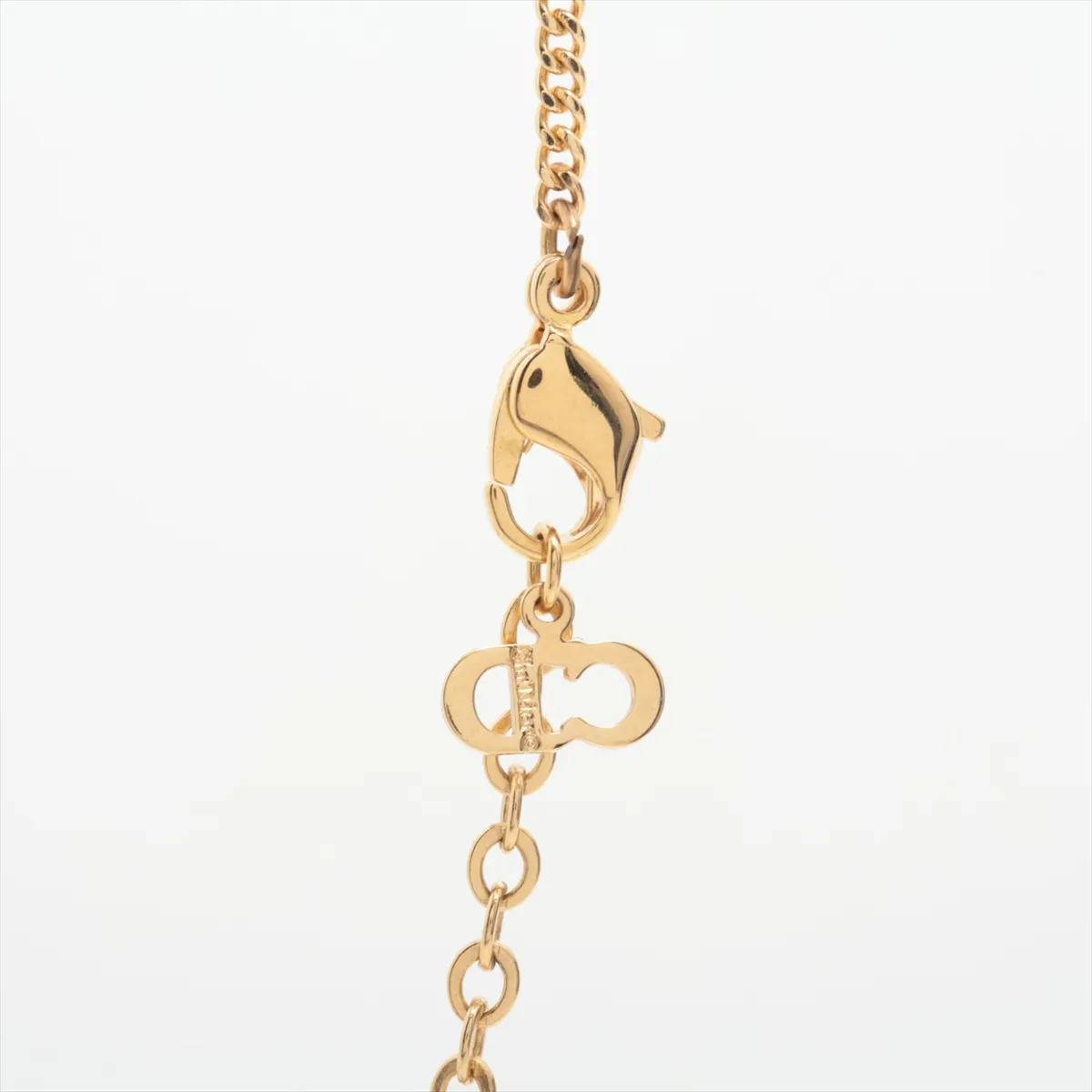 logo necklace, gold plated with rhinestones, shows signs of wear, tarnishing, — view 3