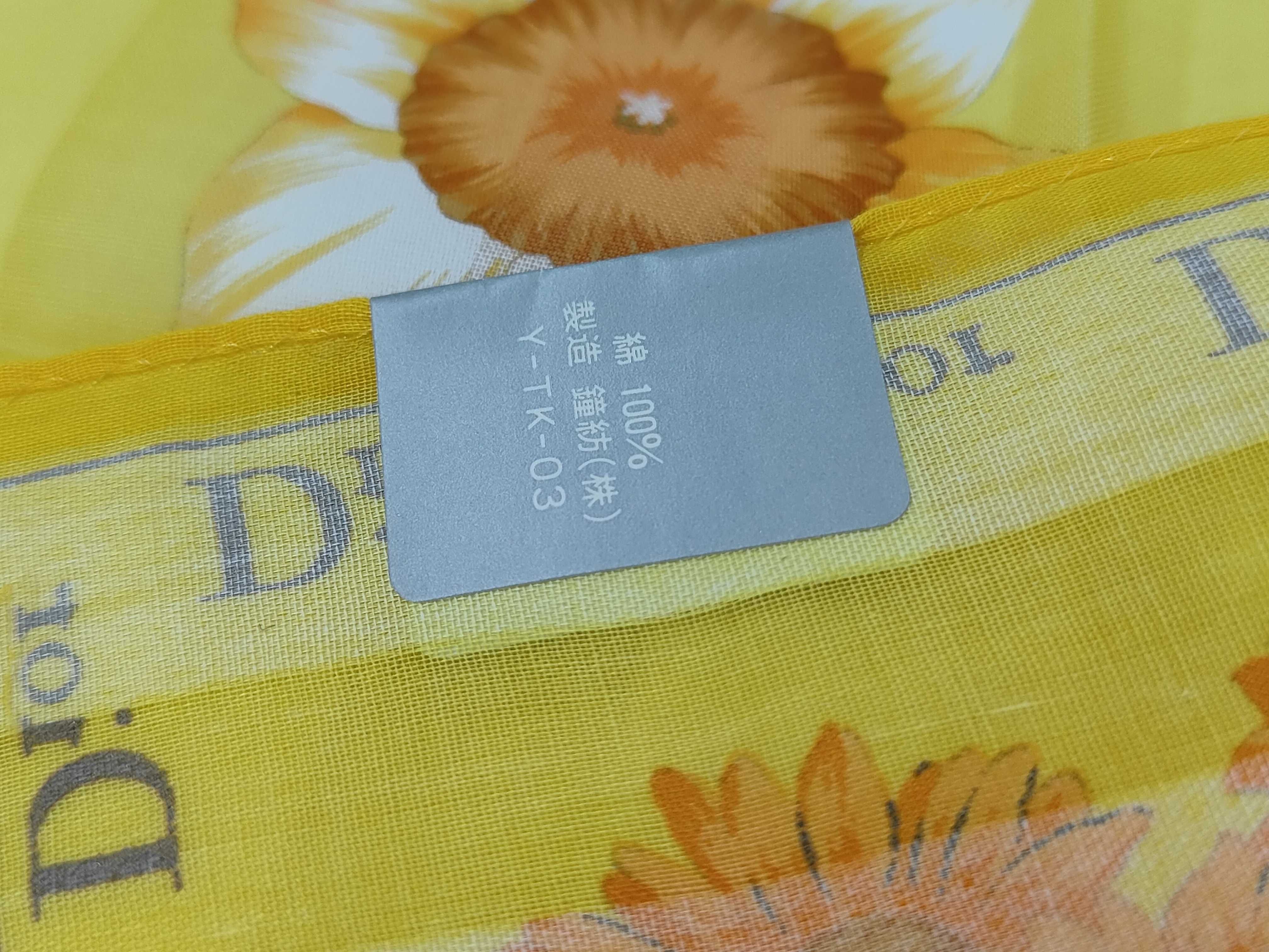 handkerchief scarf with sticker, border logo, floral pattern, orange, and other accessories. — view 4
