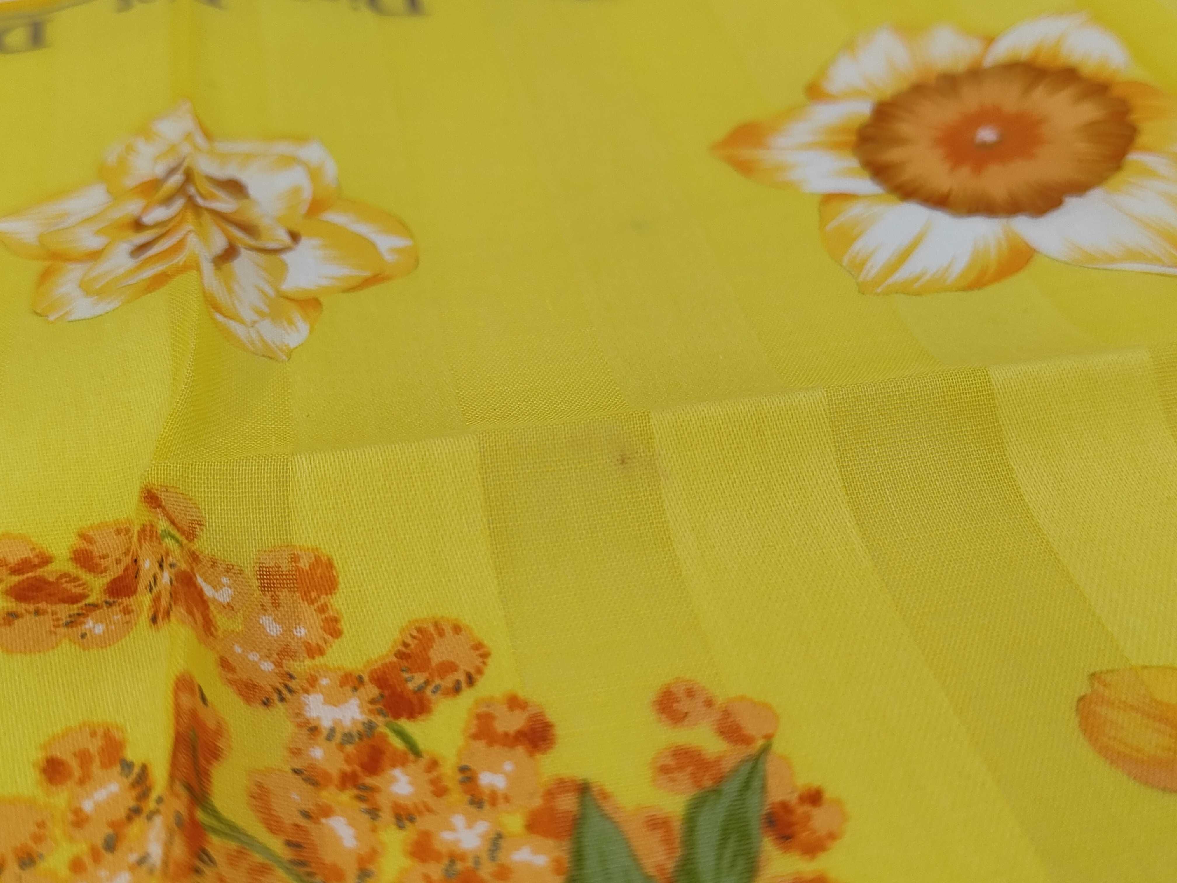 handkerchief scarf with sticker, border logo, floral pattern, orange, and other accessories. — view 5
