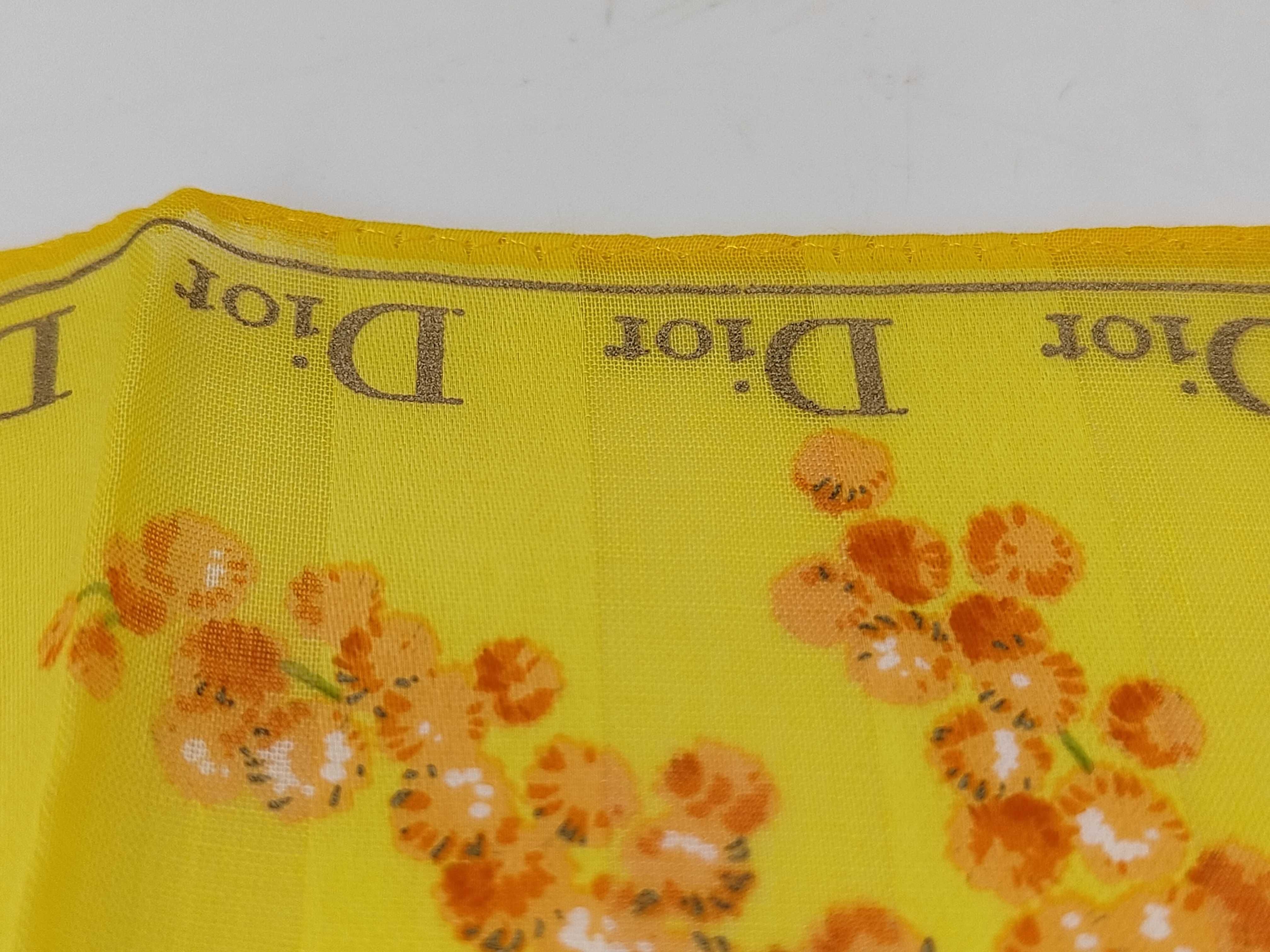 handkerchief scarf with sticker, border logo, floral pattern, orange, and other accessories. — view 6