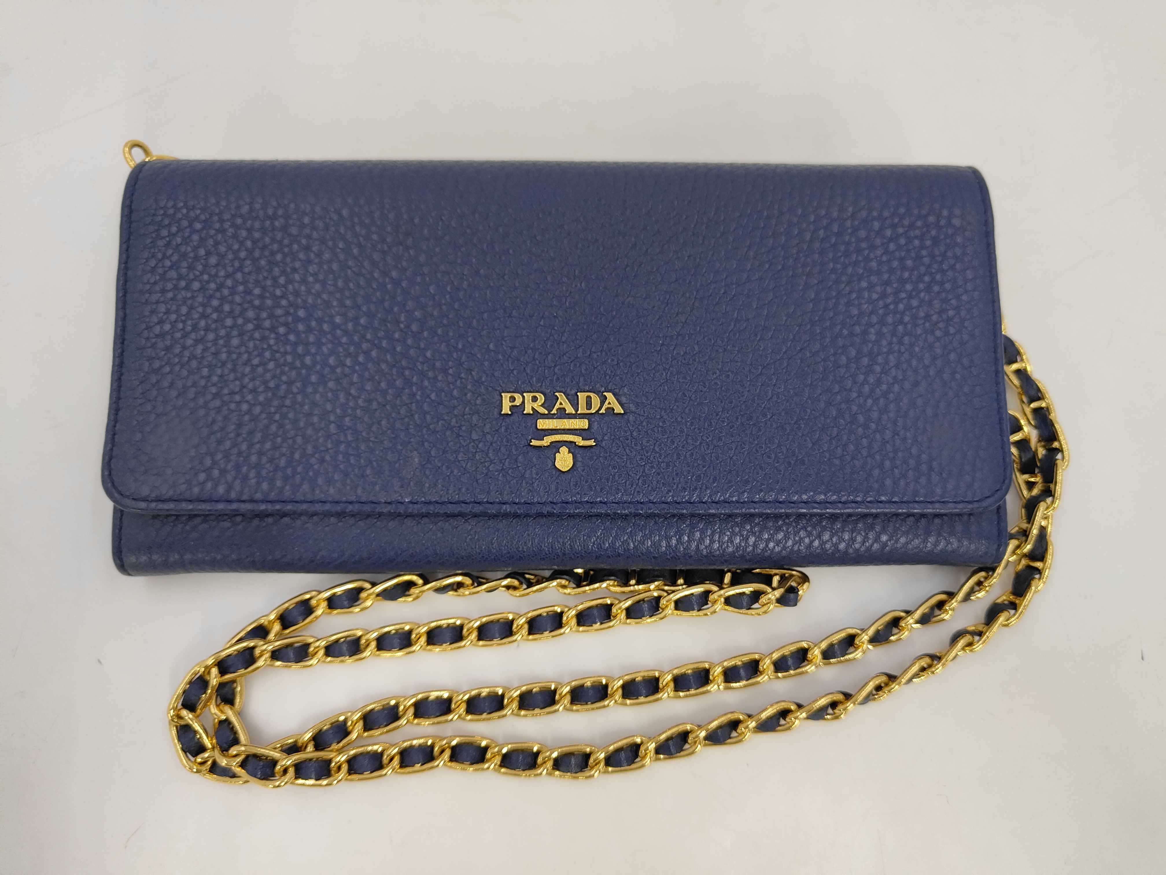 leather blue chain wallet with gold hardware, comes with box.