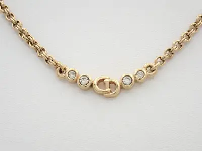 Gold necklace with stone, chain approximately 40cm long.