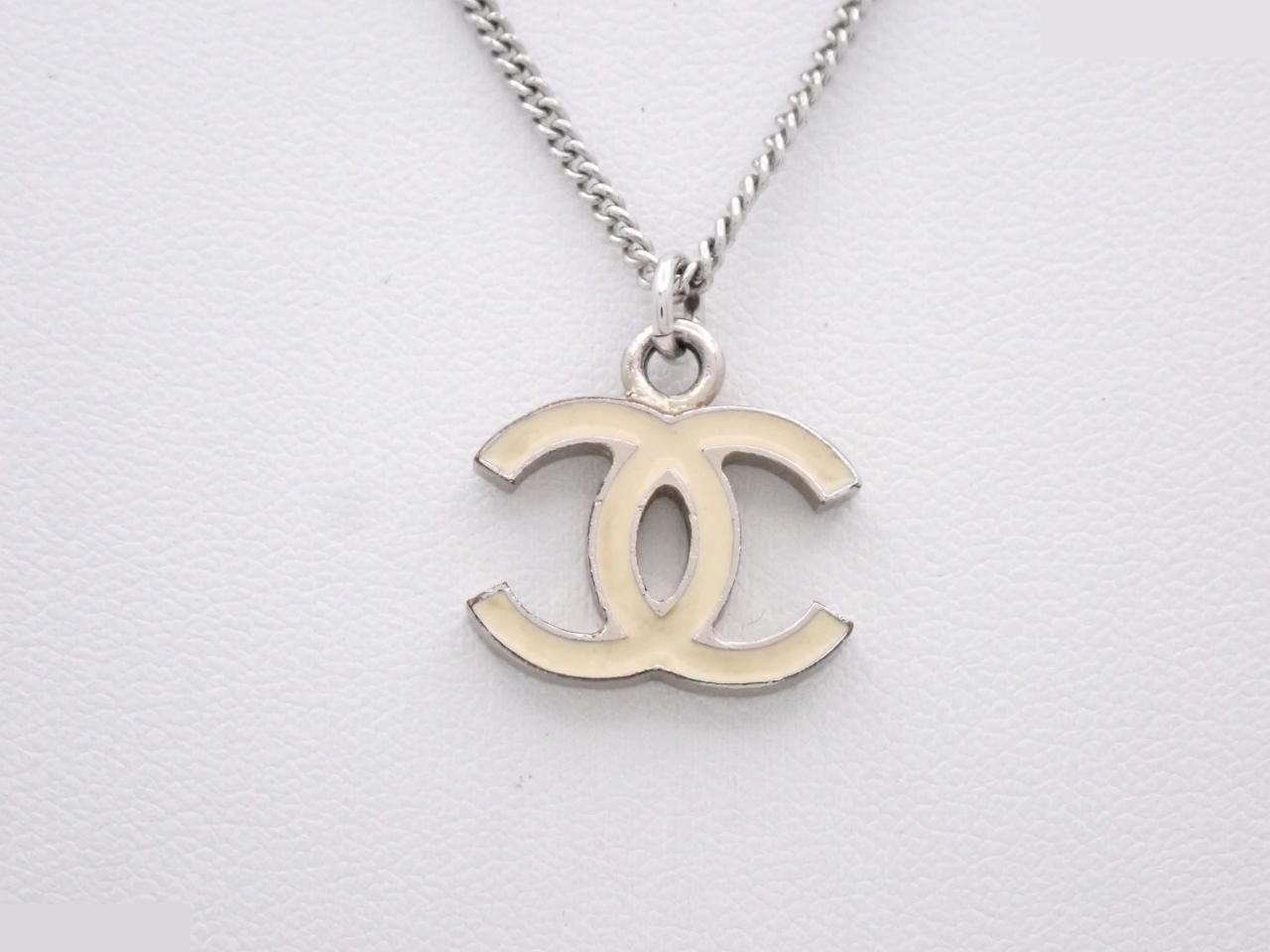 Necklace with markings; chain approximately 44cm long.