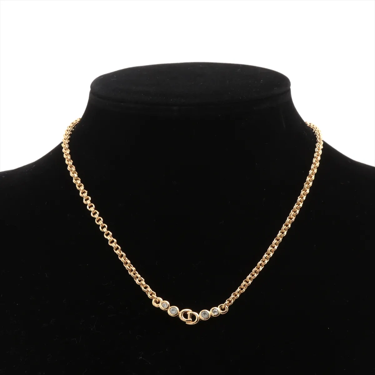 CD logo necklace, gold plated with rhinestones. Shows signs of wear, including — view 5