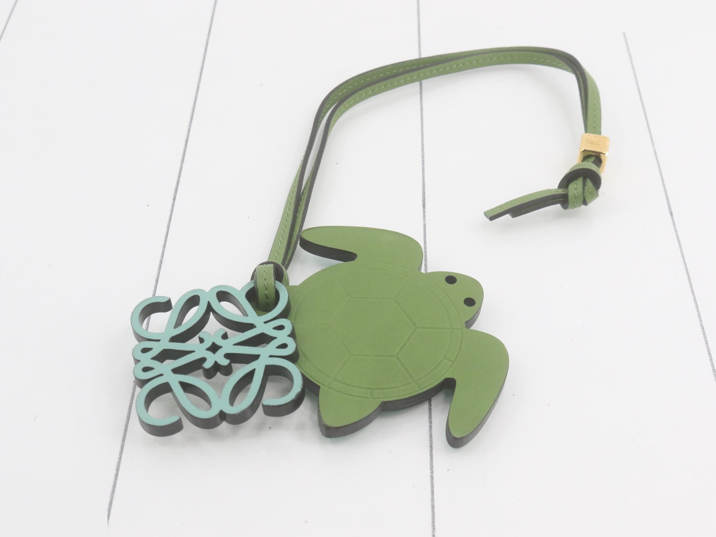 Anagram bag charm, turtle, leather, green