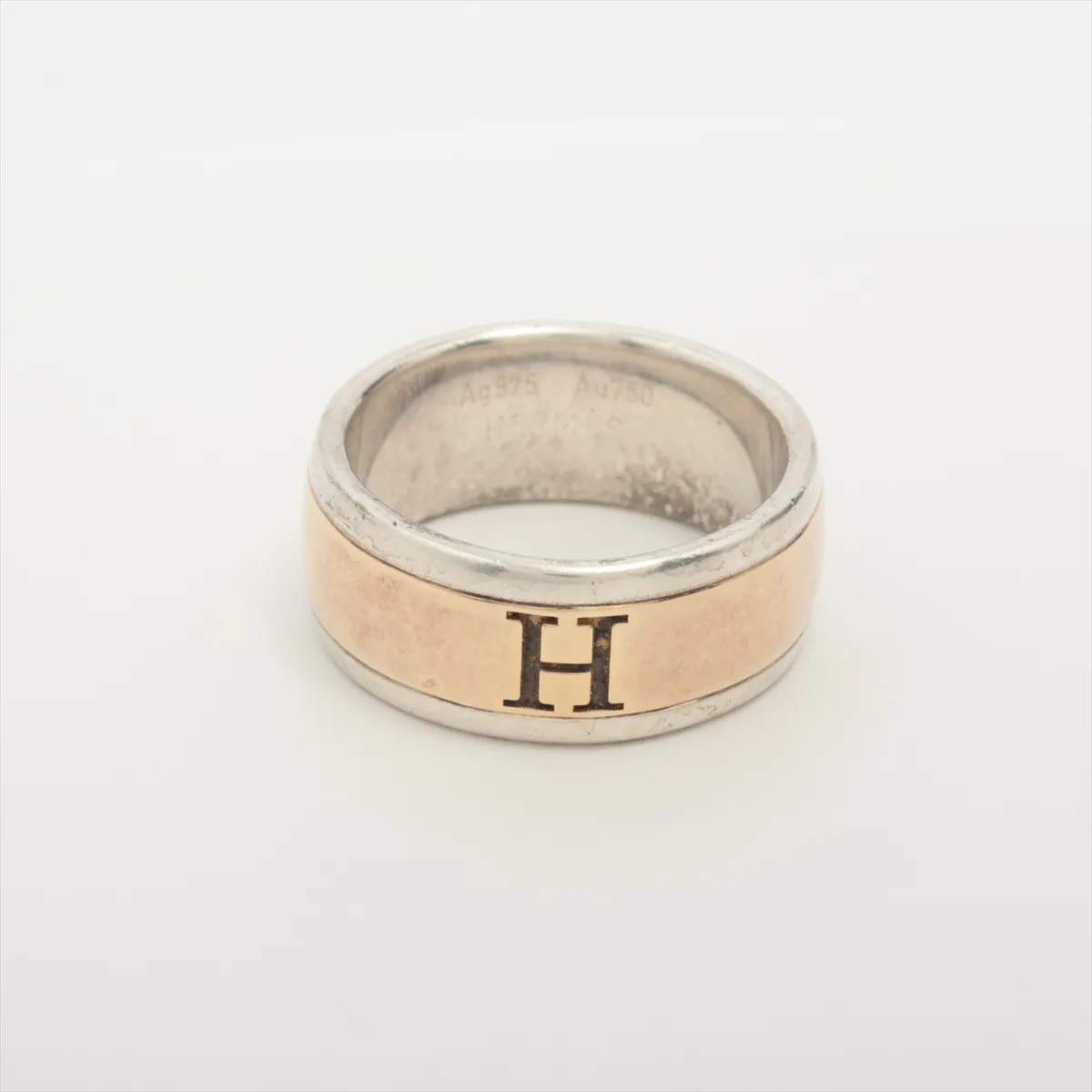 H logo ring, size 53, 925 x 750 mm, 9.0g, gold x silver. Shows signs of wear,