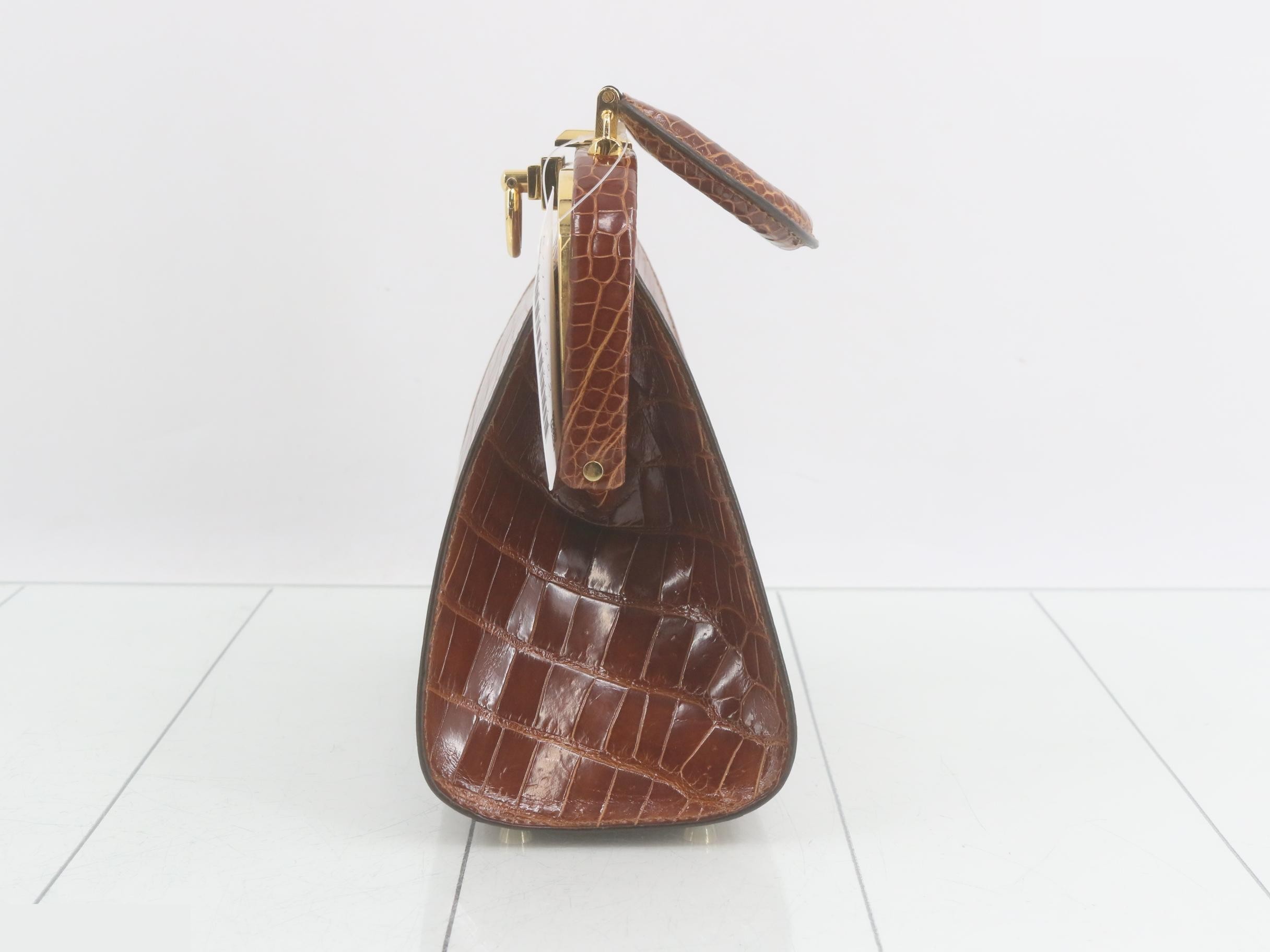 Crocodile-embossed handbag with gold hardware, brown tones. — view 3