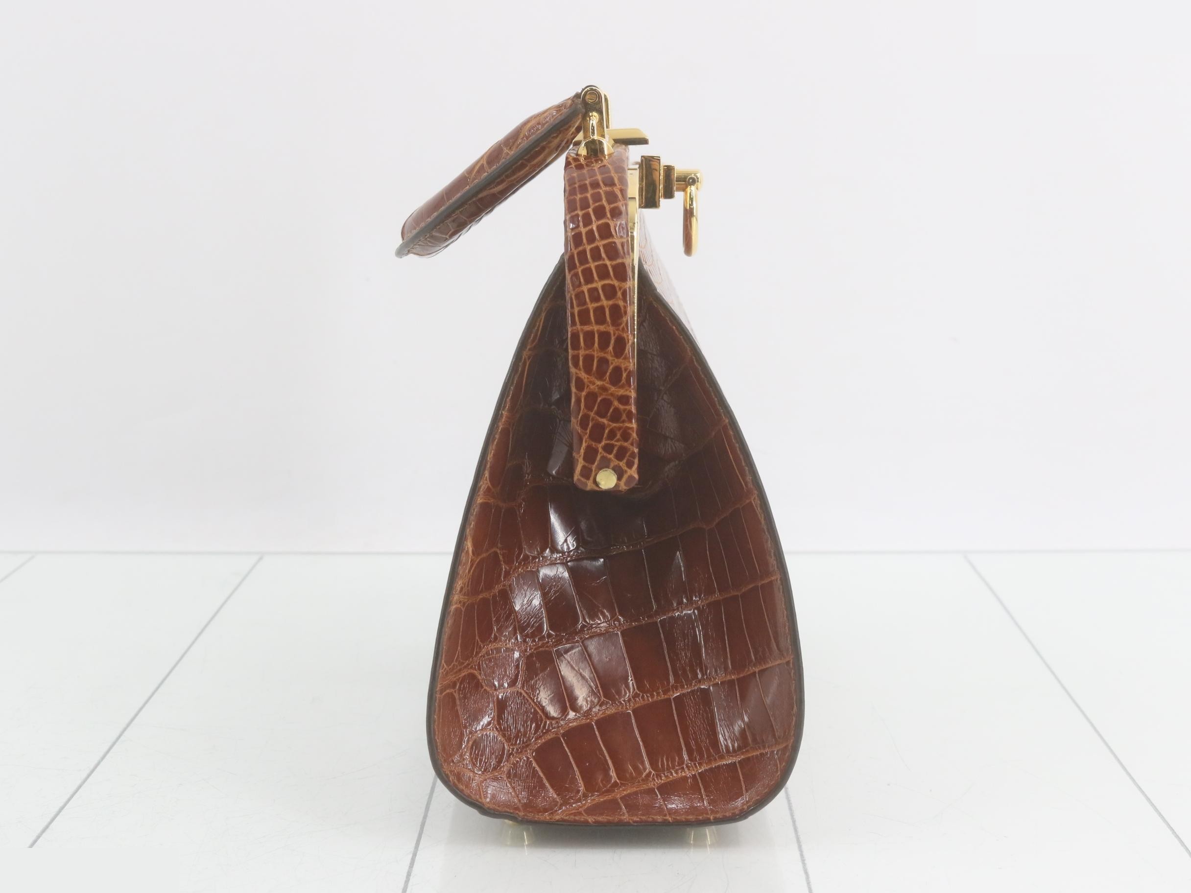 Crocodile-embossed handbag with gold hardware, brown tones. — view 4