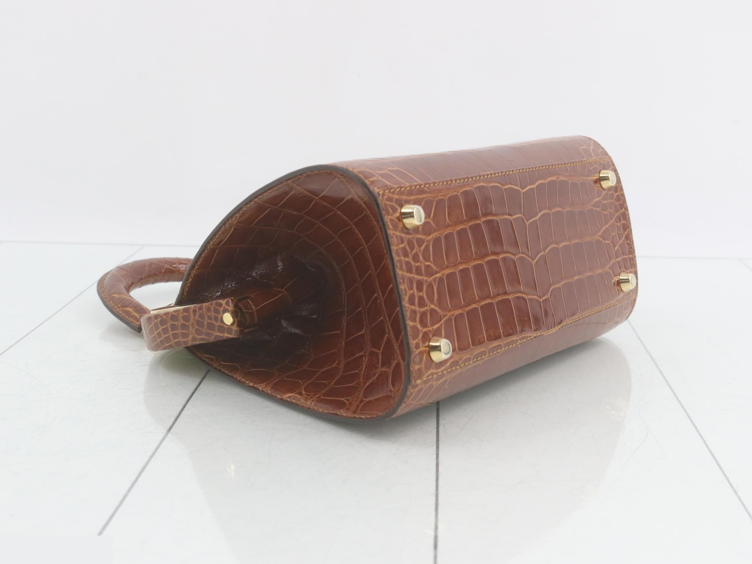 Crocodile-embossed handbag with gold hardware, brown tones. — view 5