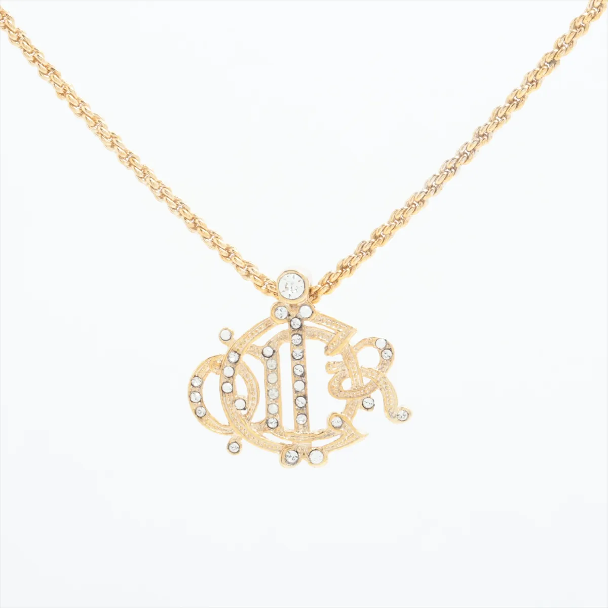 logo necklace, gold plated with rhinestones. Shows signs of wear,