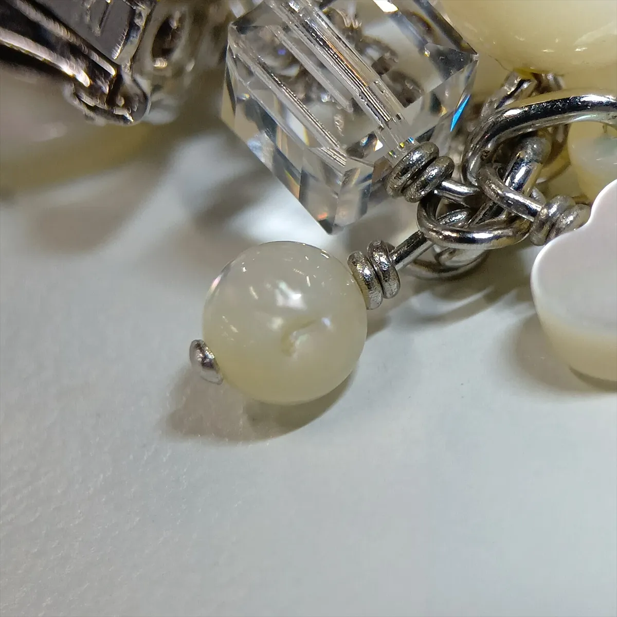 logo earrings (for both ears), metal and faux pearl, silver. Shows signs of wear, — view 6