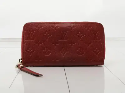 Monogram Empreinte Portefeuille Secret Long Aurore