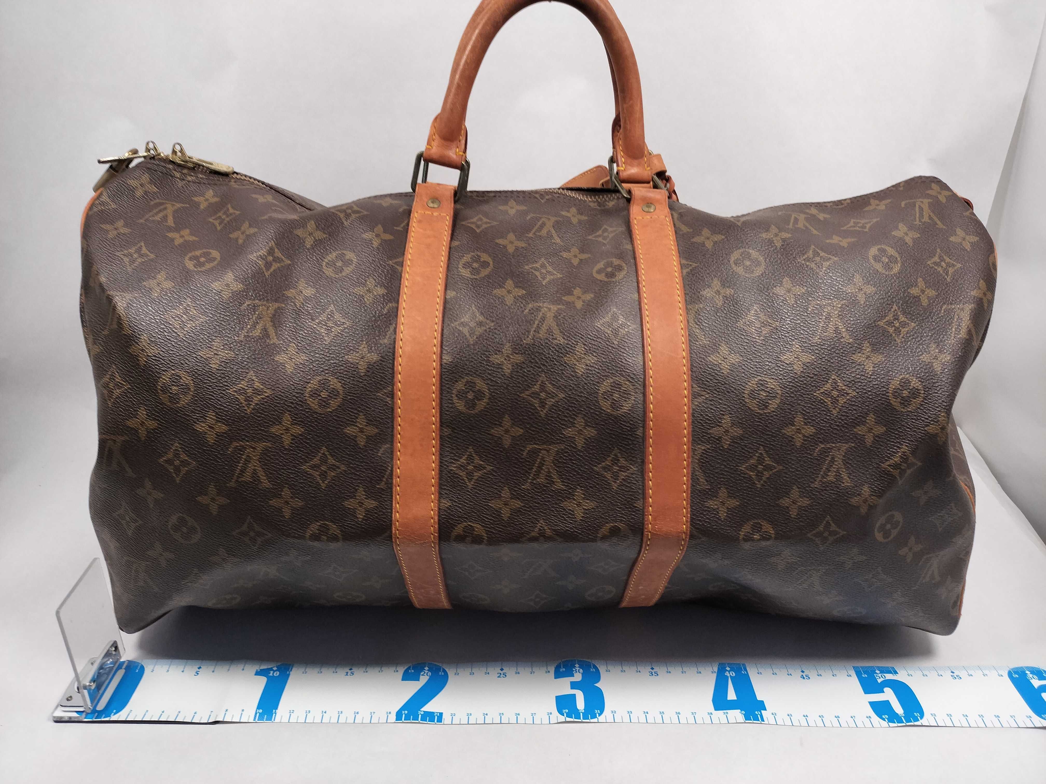 Monogram LOUIS_VUITTON M41424 Keepall 55 MI9001 Boston bag with name tag, handle strap, and padlock. — view 2