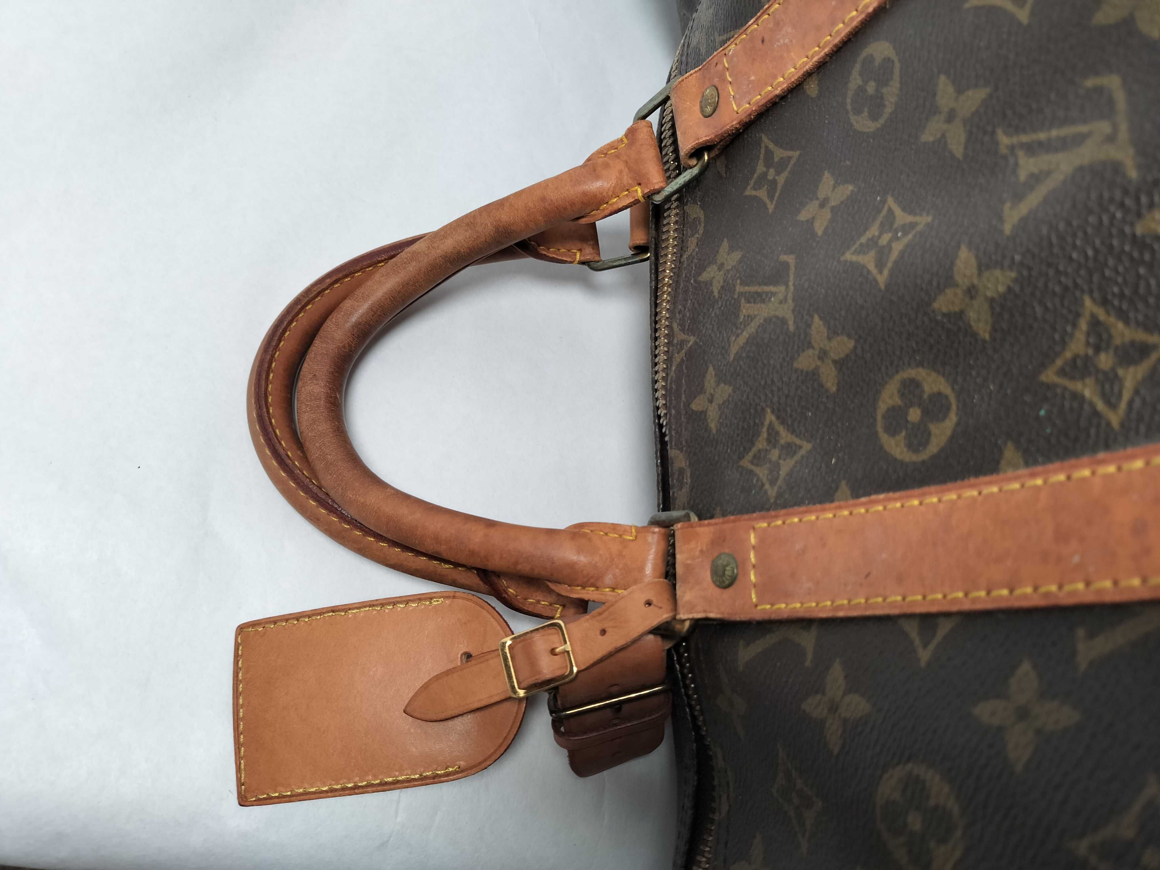 Monogram LOUIS_VUITTON M41424 Keepall 55 MI9001 Boston bag with name tag, handle strap, and padlock. — view 3