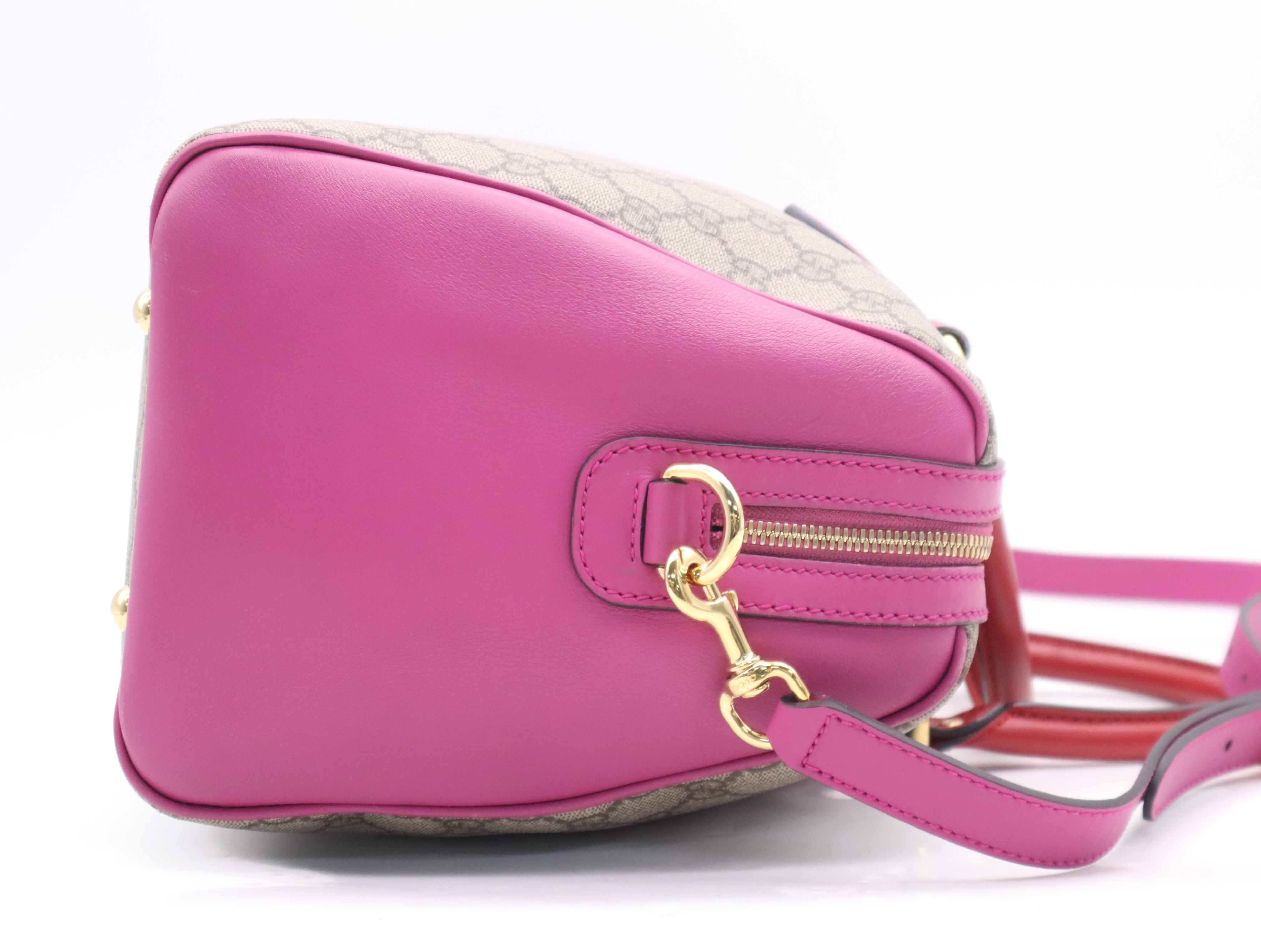 409527 GG Supreme 2-way Boston bag in beige, pink, and red with gold hardware and shoulder strap. — view 5