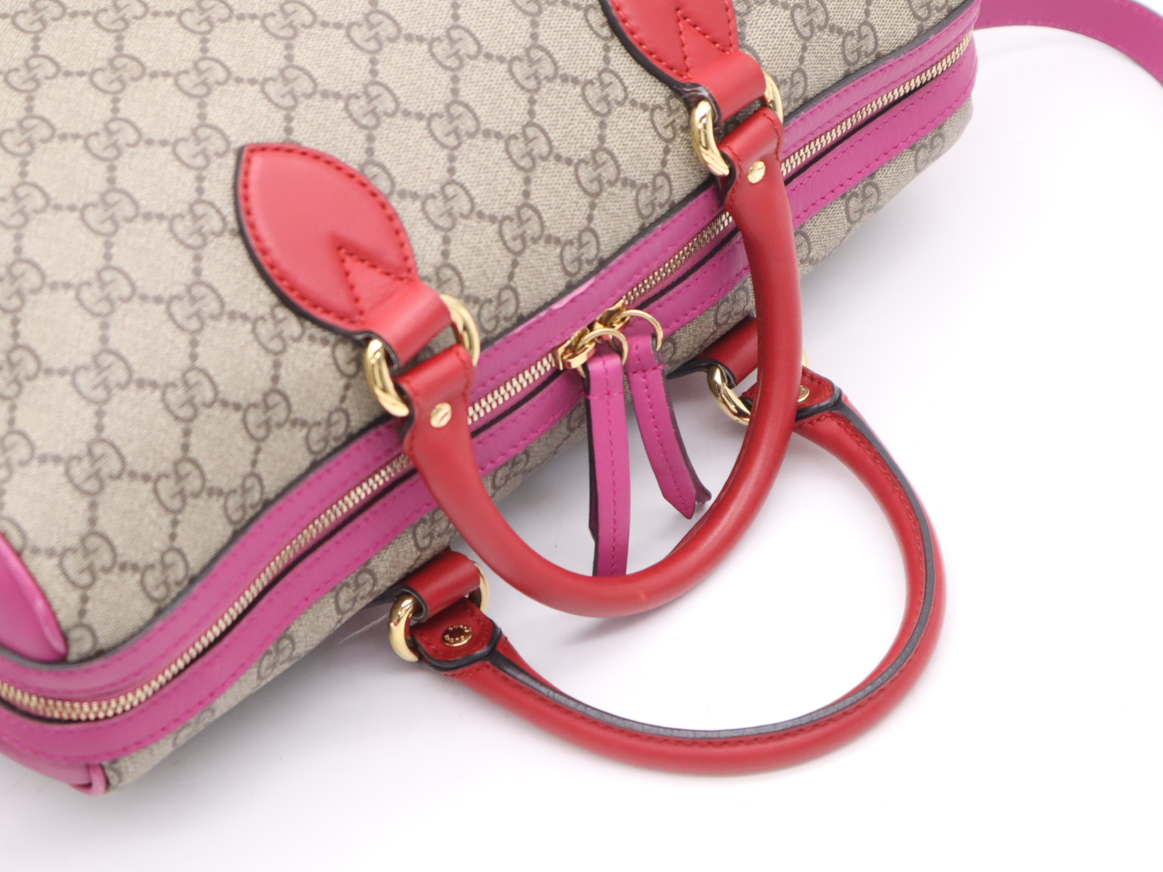 409527 GG Supreme 2-way Boston bag in beige, pink, and red with gold hardware and shoulder strap. — view 6