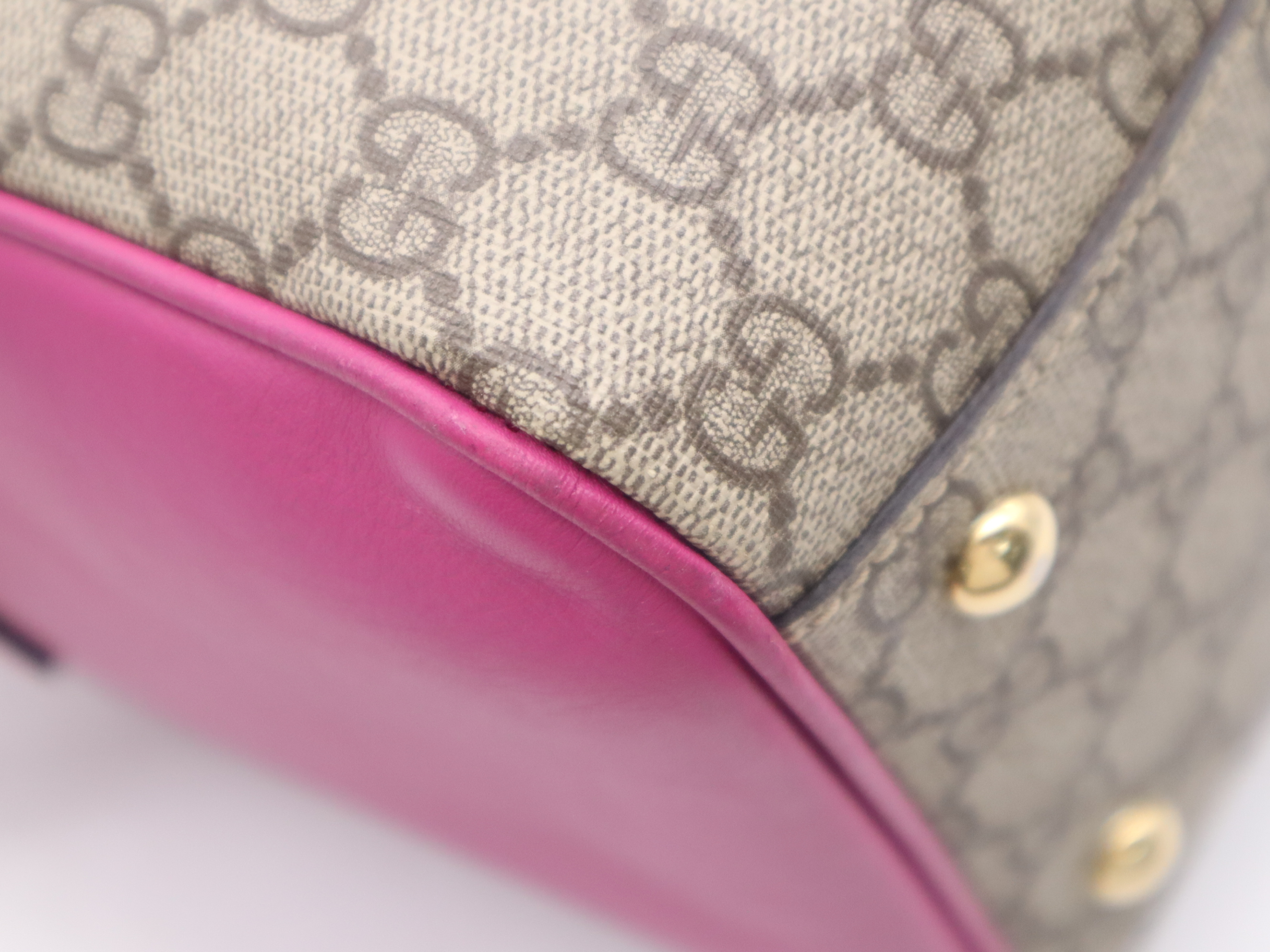 409527 GG Supreme 2-way Boston bag in beige, pink, and red with gold hardware and shoulder strap. — view 10