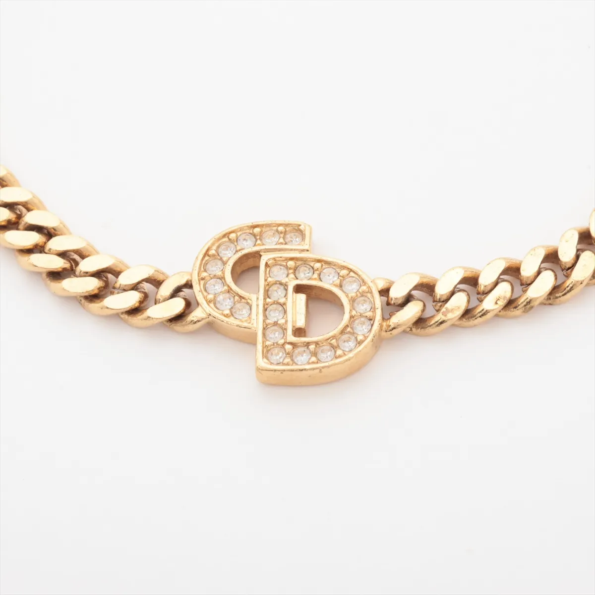 CD logo bracelet, gold plated with rhinestones. Shows signs of wear, including — view 2