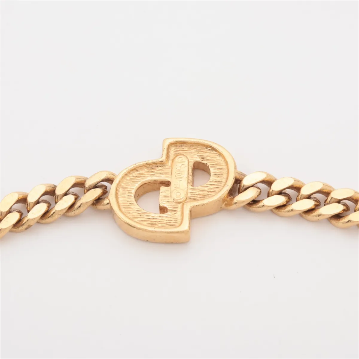 CD logo bracelet, gold plated with rhinestones. Shows signs of wear, including — view 3