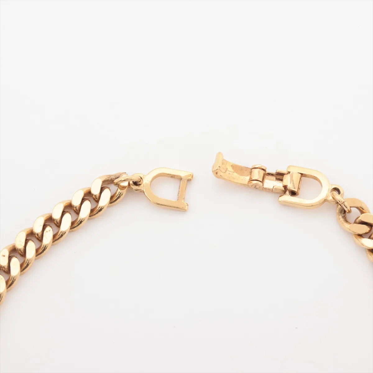CD logo bracelet, gold plated with rhinestones. Shows signs of wear, including — view 4