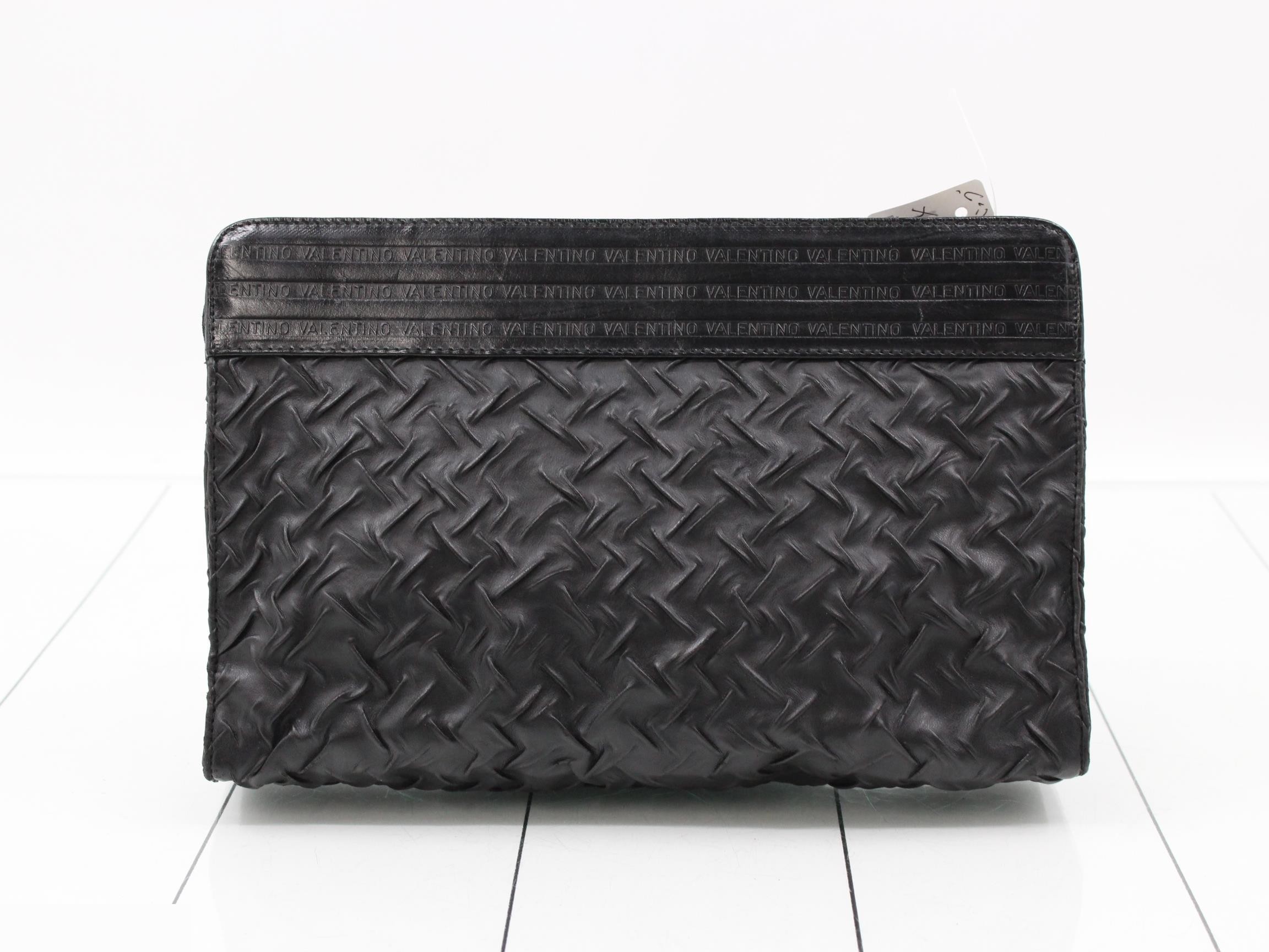 Leather clutch bag with paper tag. — view 2