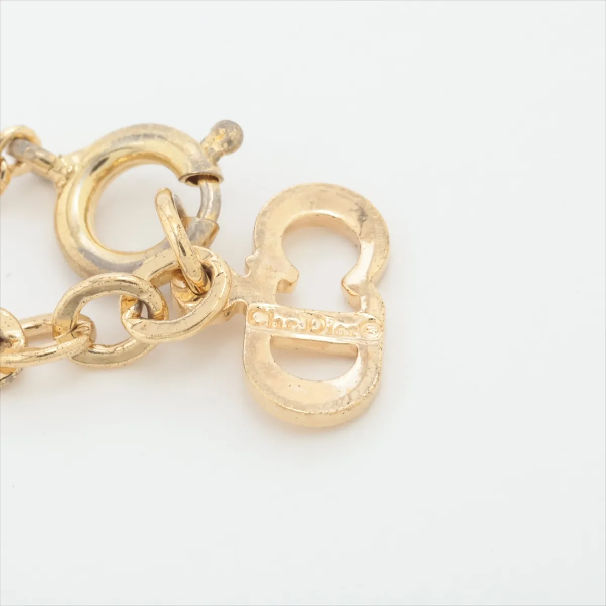 CD logo necklace, gold plated with rhinestones. Shows signs of wear, — view 4