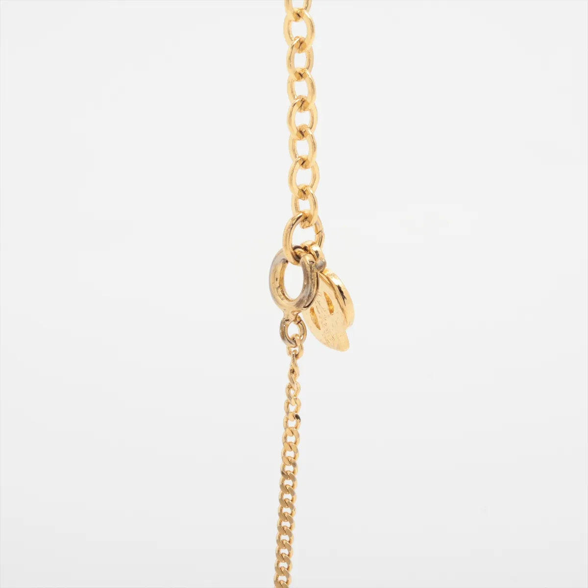 CD logo necklace, gold plated with rhinestones. Shows signs of wear, including — view 3