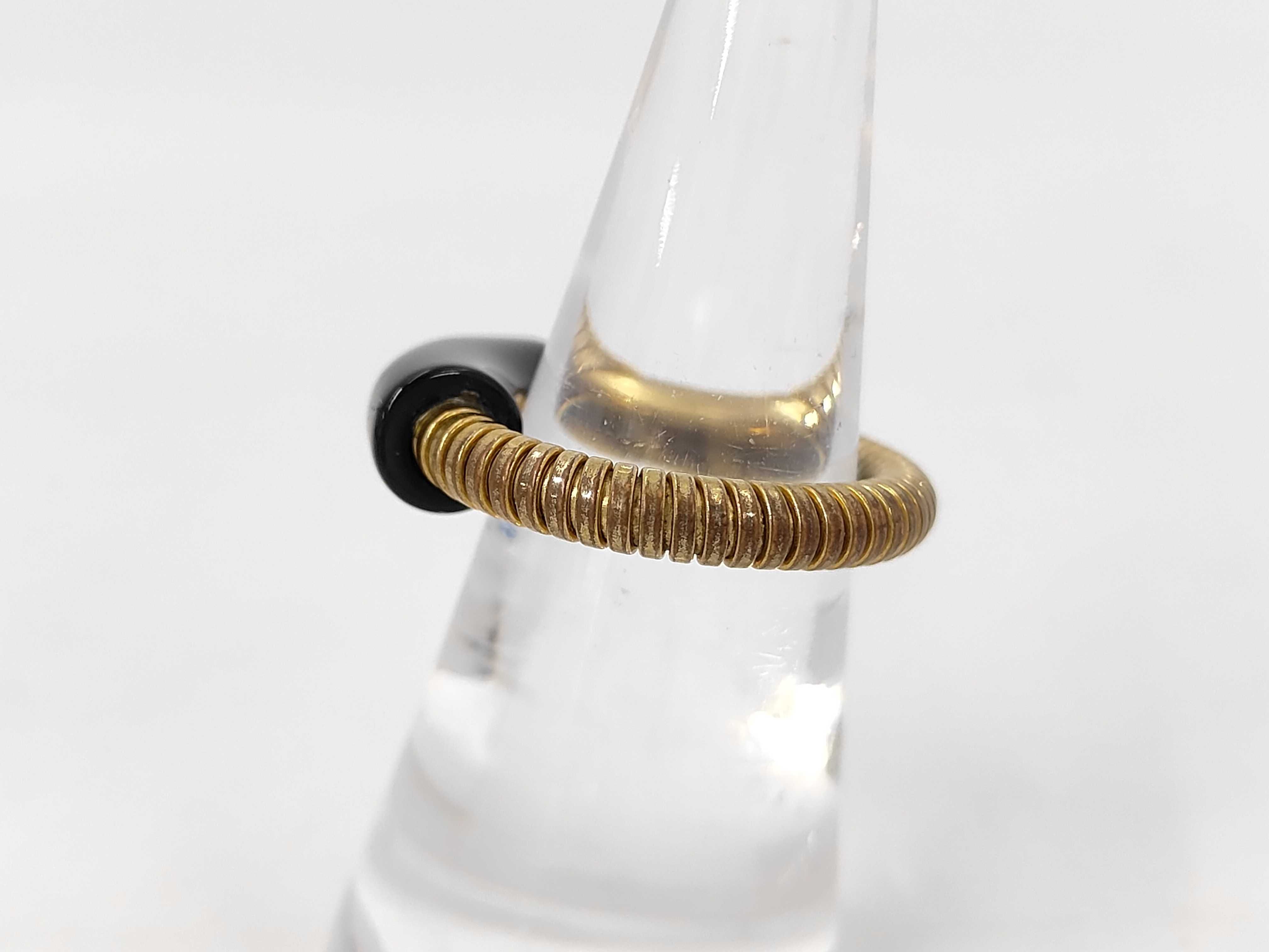 logo gold x black RG ring — view 2