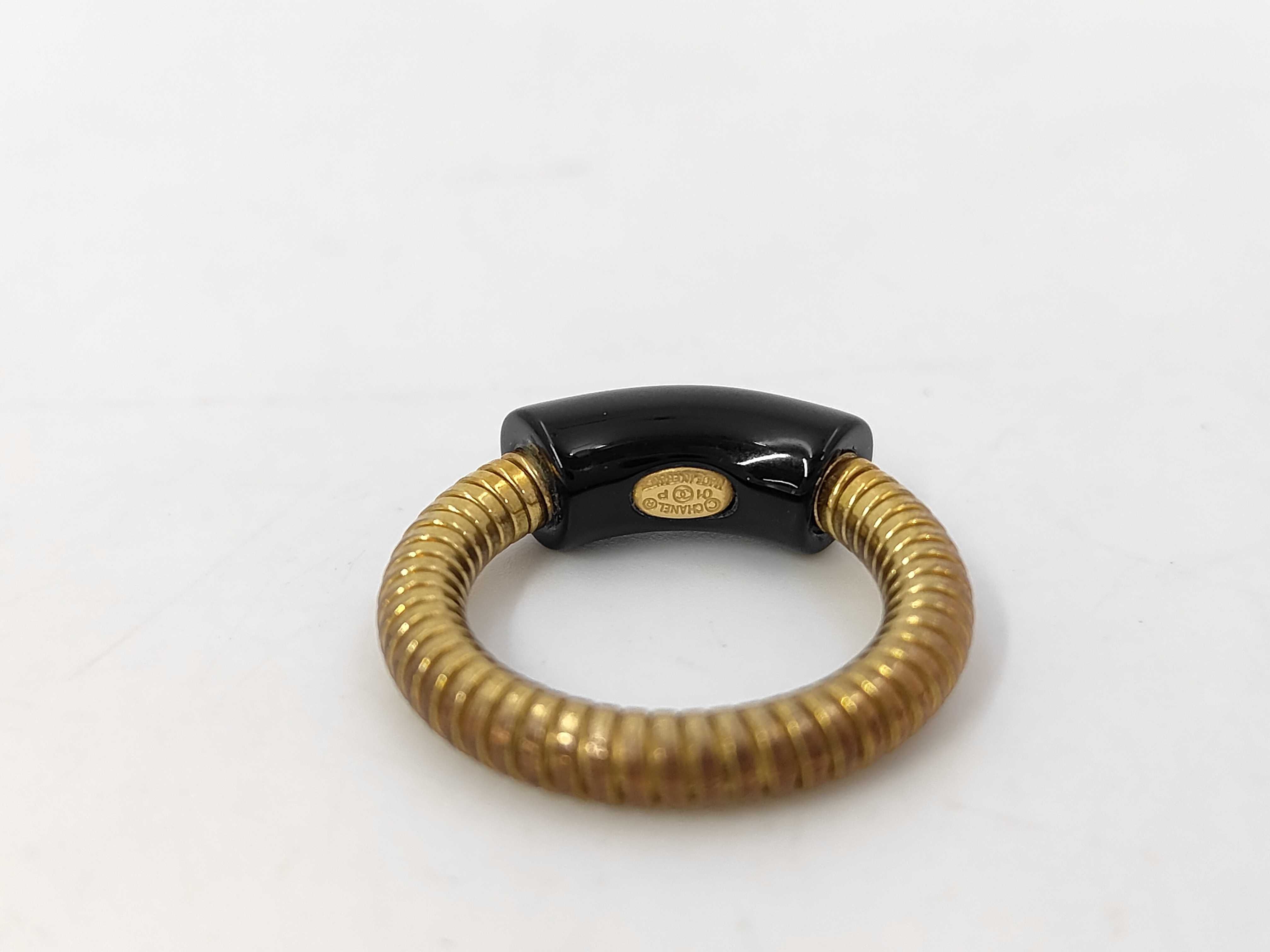 logo gold x black RG ring — view 4