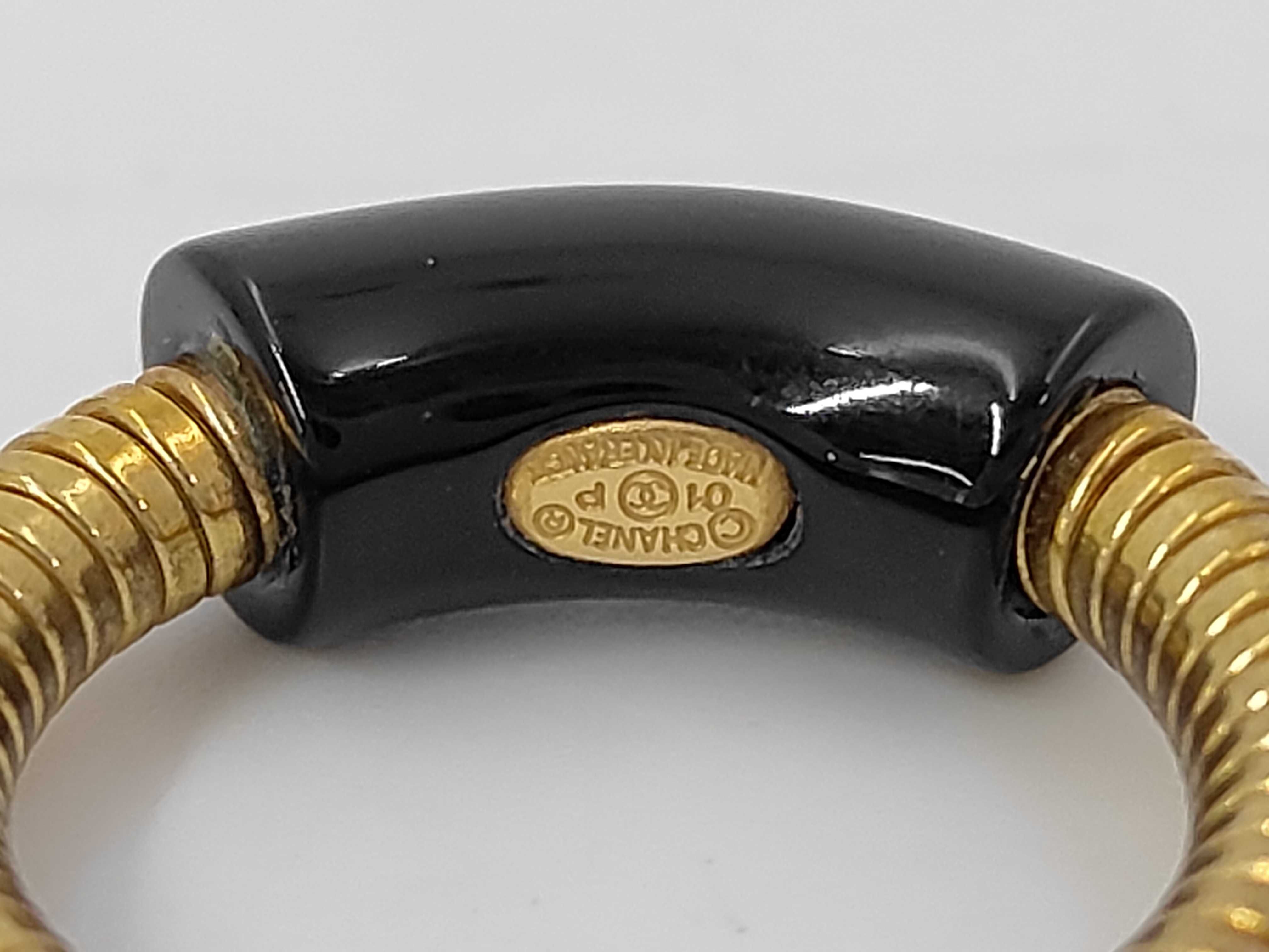 logo gold x black RG ring — view 5