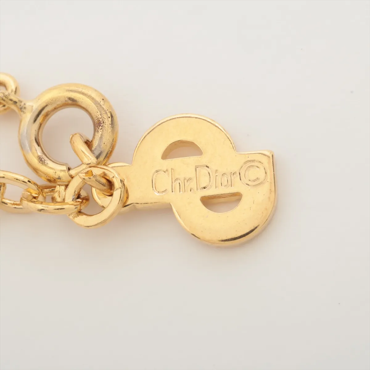 logo necklace, gold plated with rhinestones. Shows signs of wear, tarnishing, — view 4