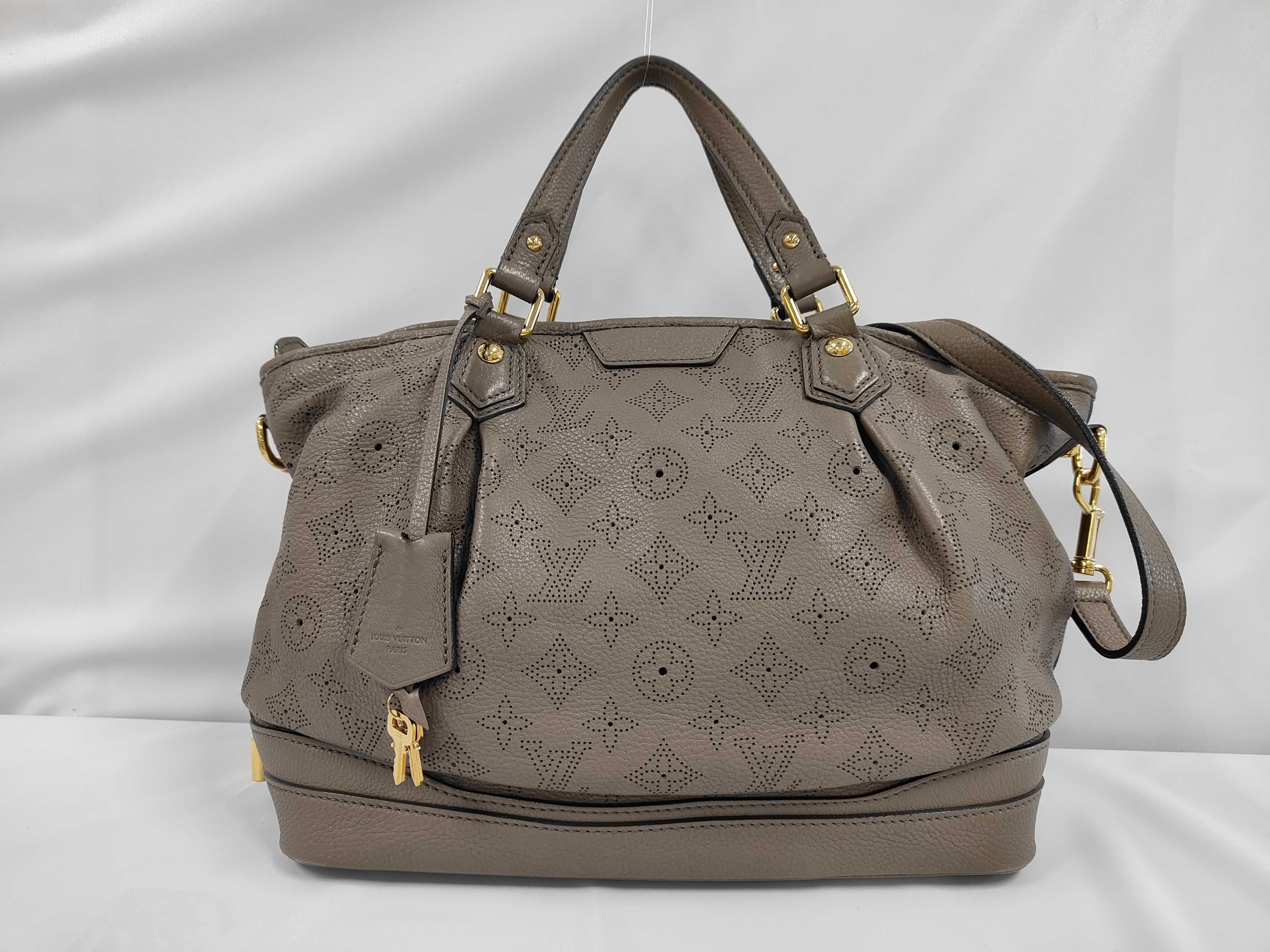 M93063 Stella PM AR1132 Handbag with strap, padlock, key, and clochette.