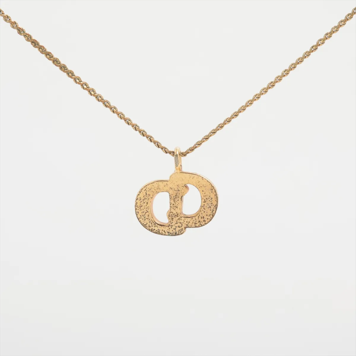 CD logo necklace, gold plated with rhinestones. Shows signs of wear, including dents, — view 2