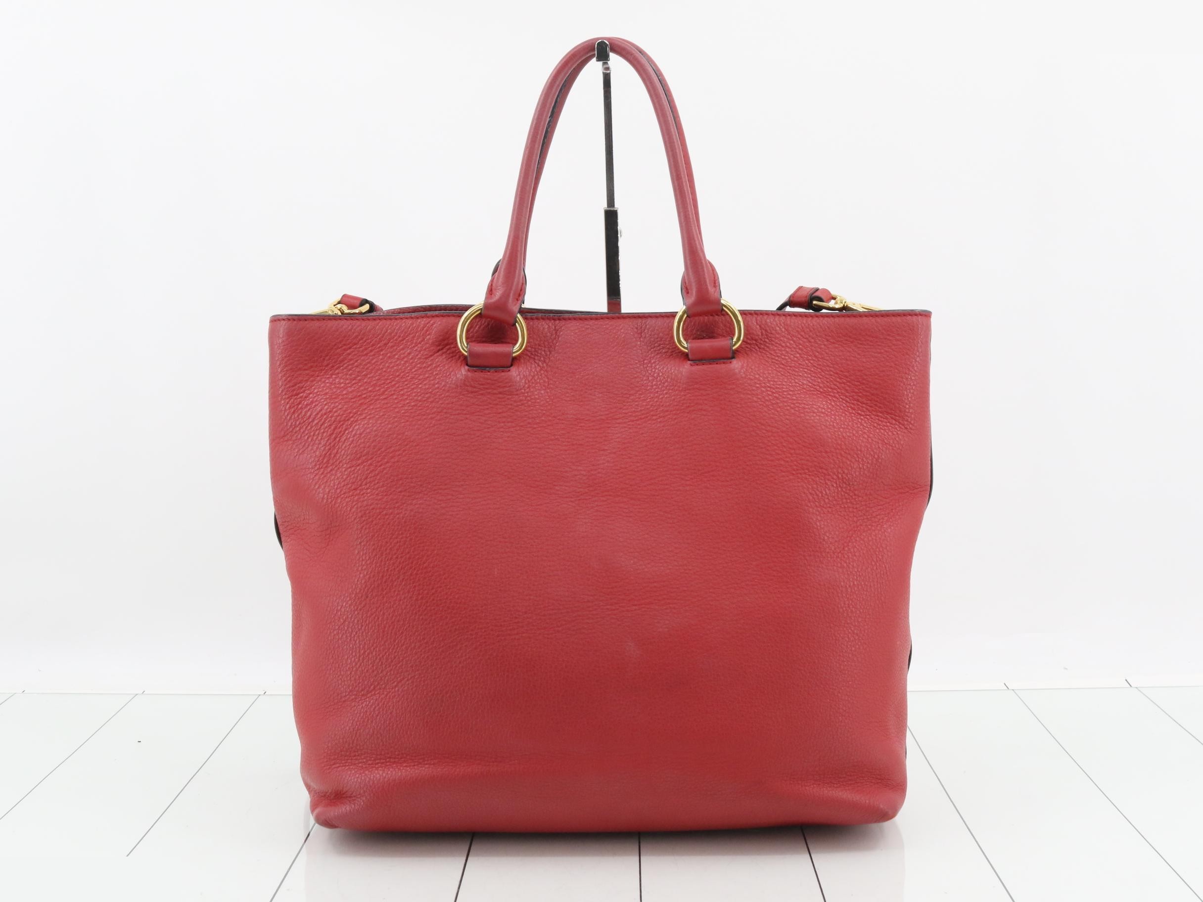 Leather tote bag, red, gold hardware, with shoulder strap and name tag. — view 2