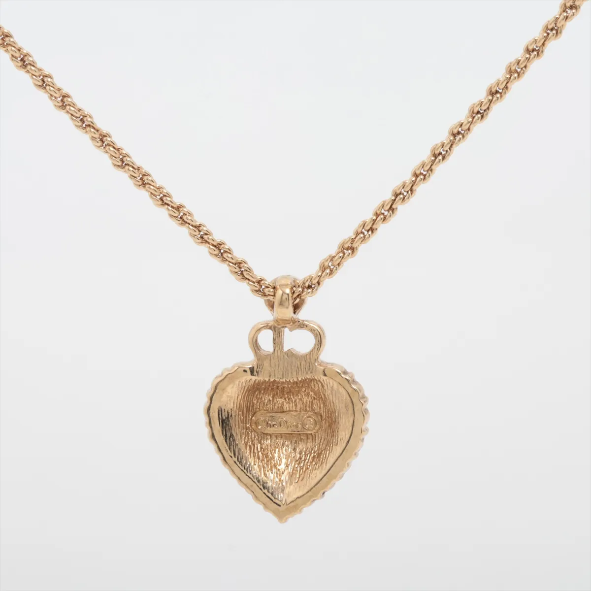 CD logo necklace, gold plated with rhinestones, shows signs of wear, tarnishing, — view 2