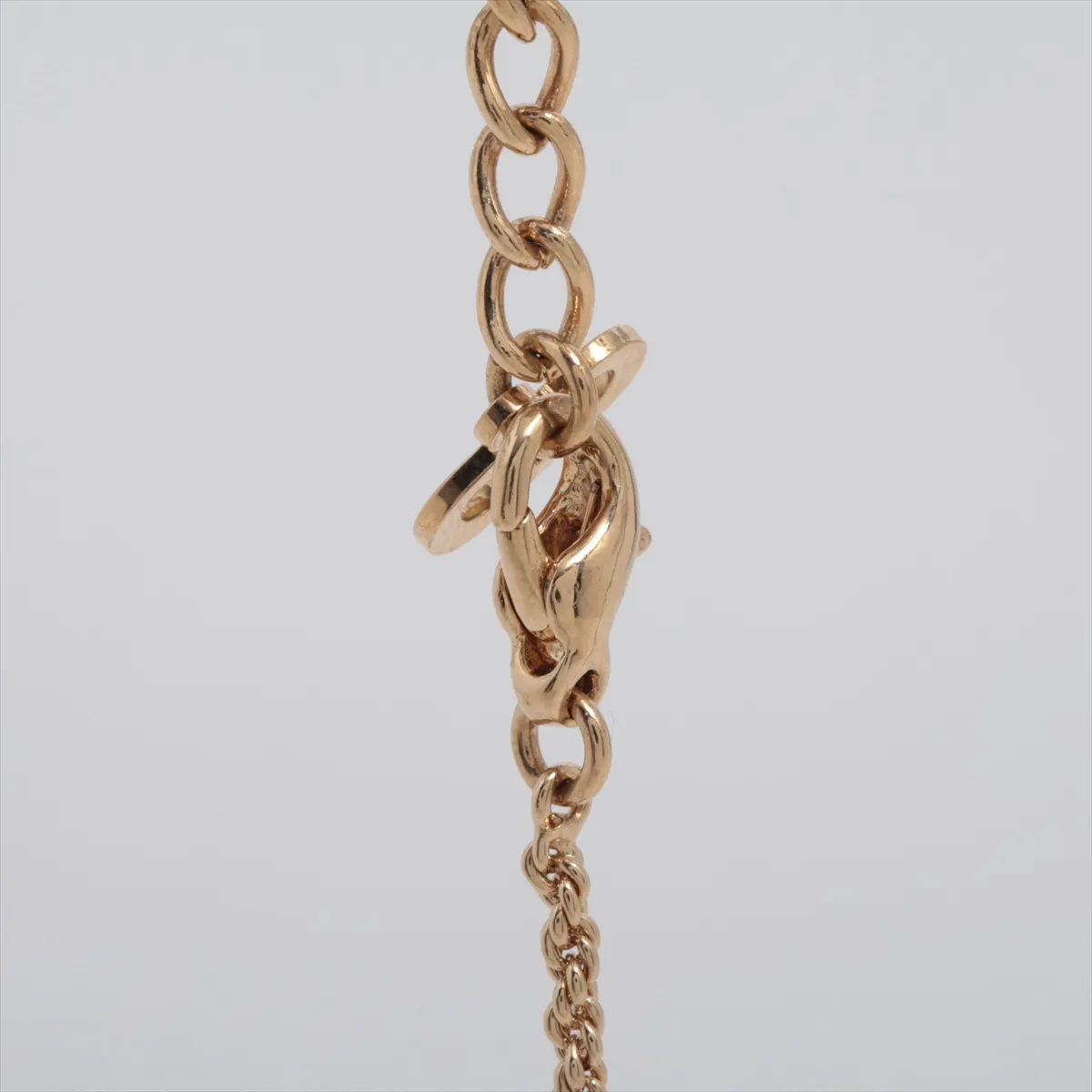 CD logo necklace, gold plated with rhinestones, shows signs of wear, tarnishing, — view 3