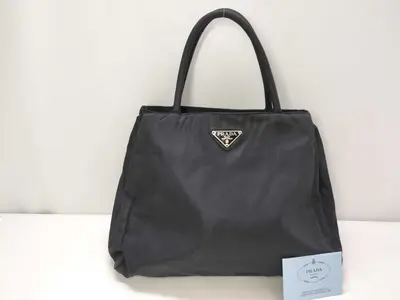nylon handbag, Prada nylon handbag with triangular logo.