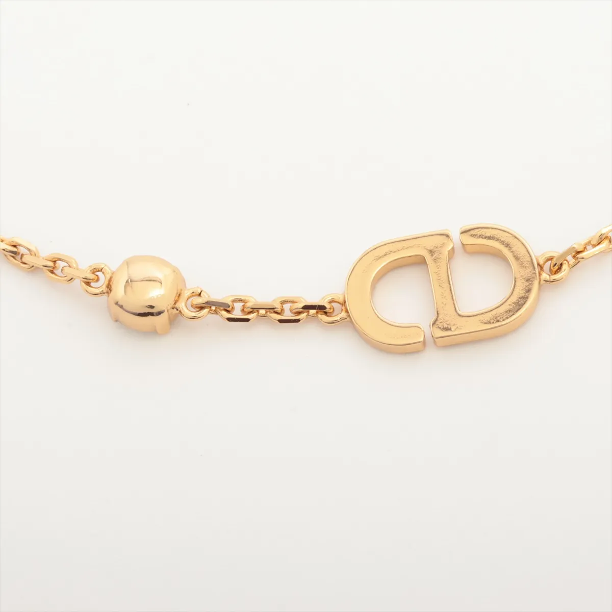 Petit CD bracelet, gold-plated with rhinestones. Shows signs of wear including — view 3