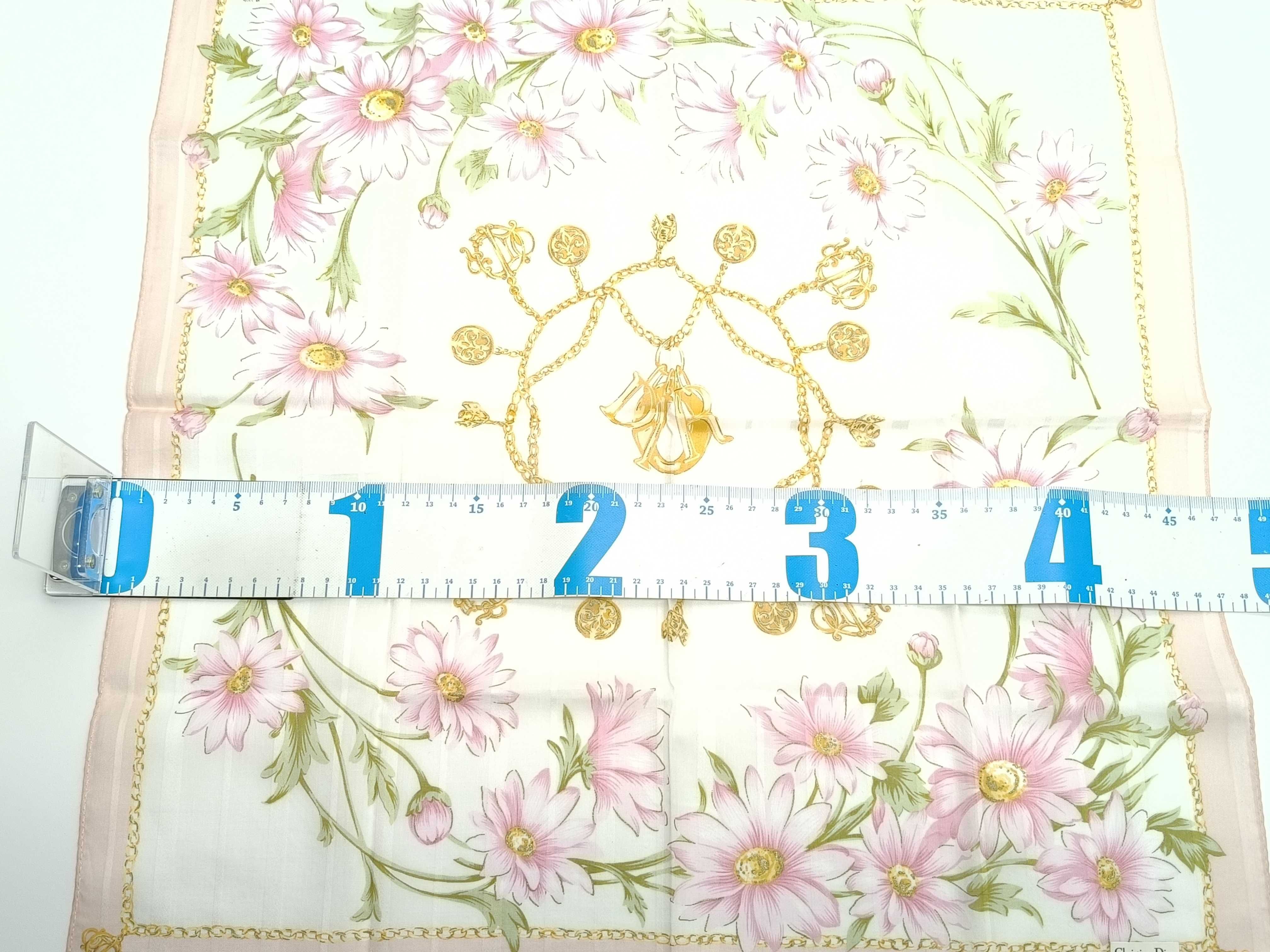 handkerchief scarf with sticker, emblem, logo chain, floral pattern, pink, and other accessories. — view 2