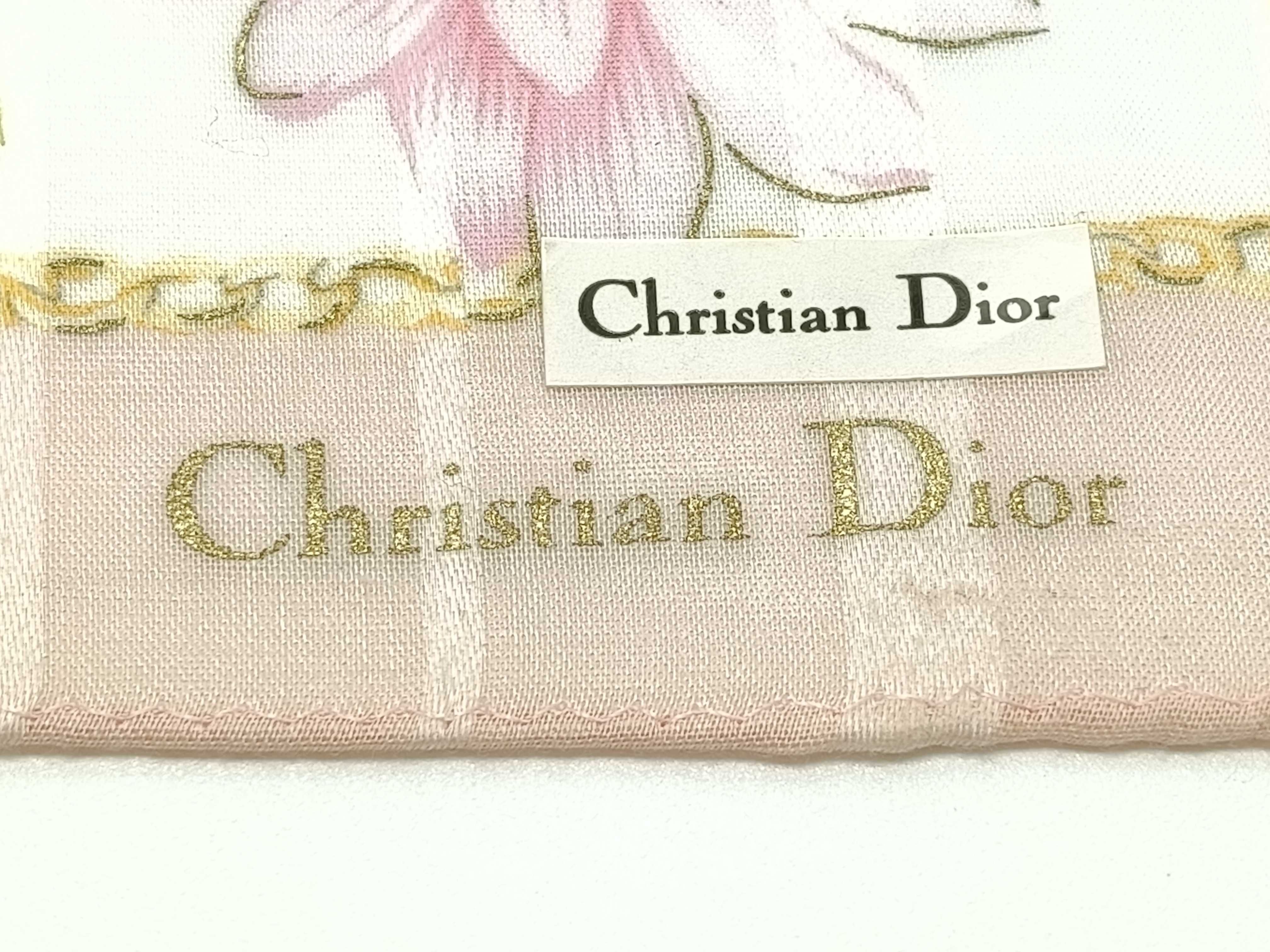 handkerchief scarf with sticker, emblem, logo chain, floral pattern, pink, and other accessories. — view 3
