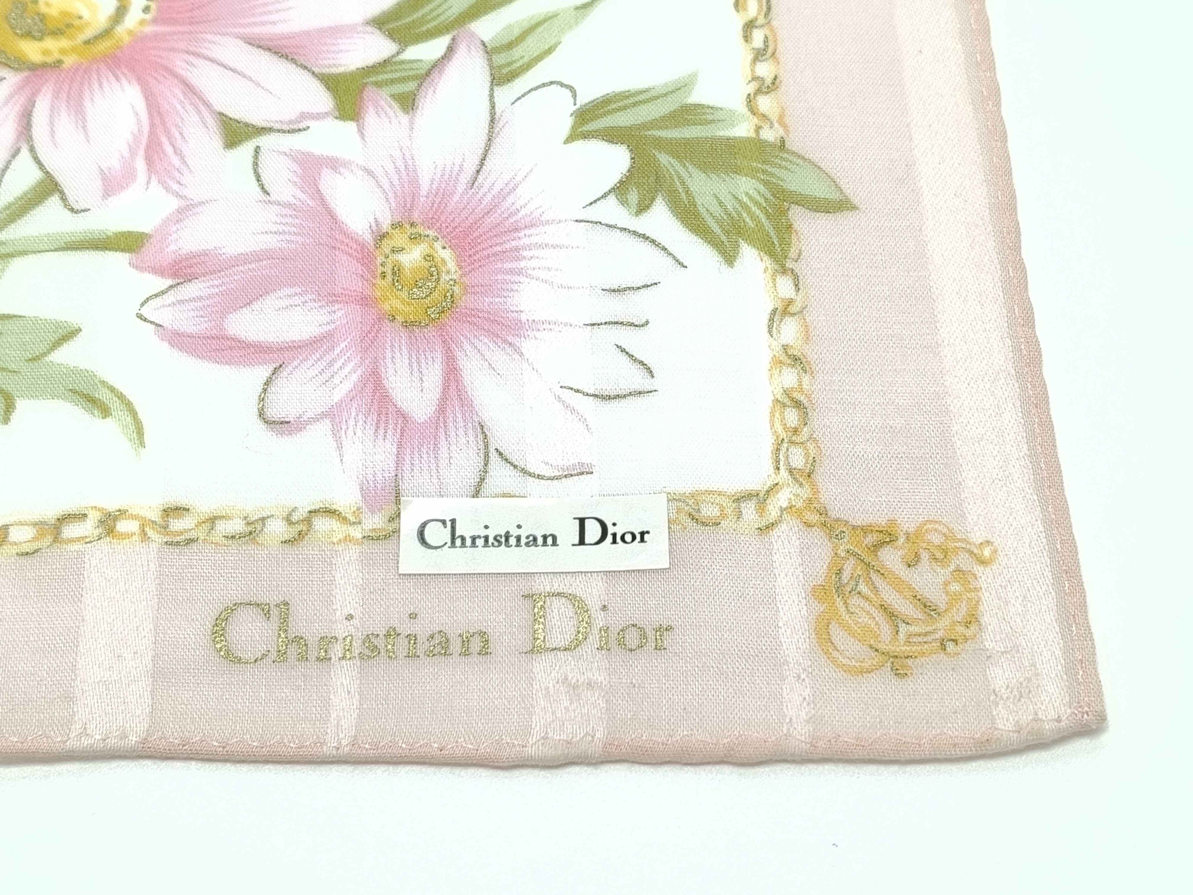 handkerchief scarf with sticker, emblem, logo chain, floral pattern, pink, and other accessories. — view 5