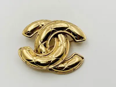 Coco Mark Matelassé Brooch, stamped 1142.