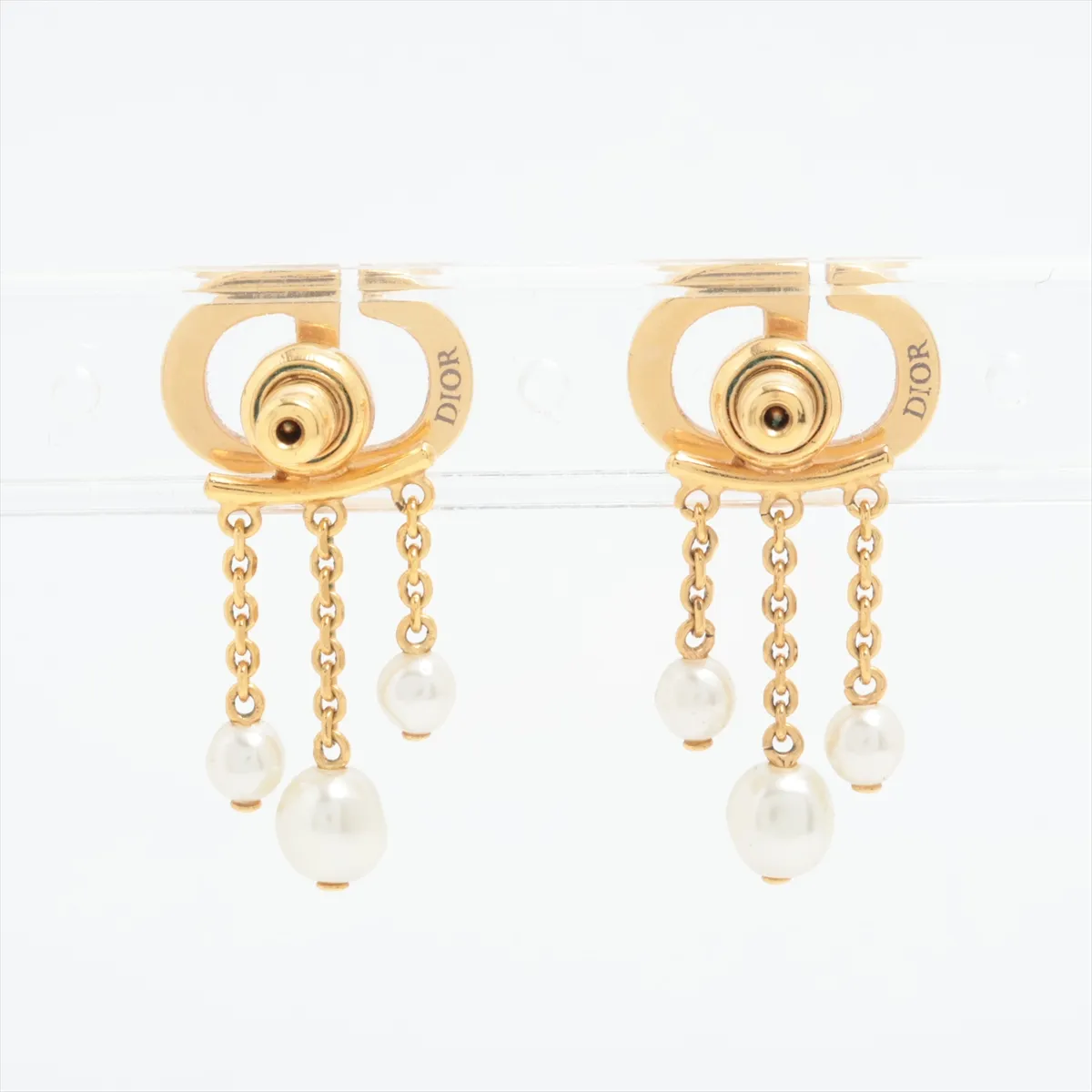CD Navy earrings (for both ears), gold-plated with rhinestones and faux pearls. Shows signs of wear including — view 2