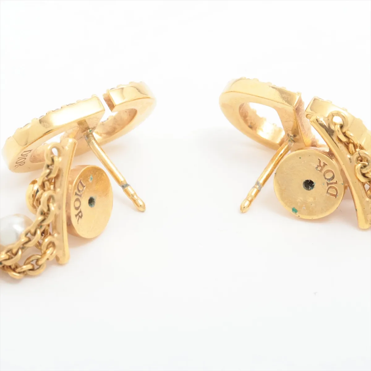 CD Navy earrings (for both ears), gold-plated with rhinestones and faux pearls. Shows signs of wear including — view 4