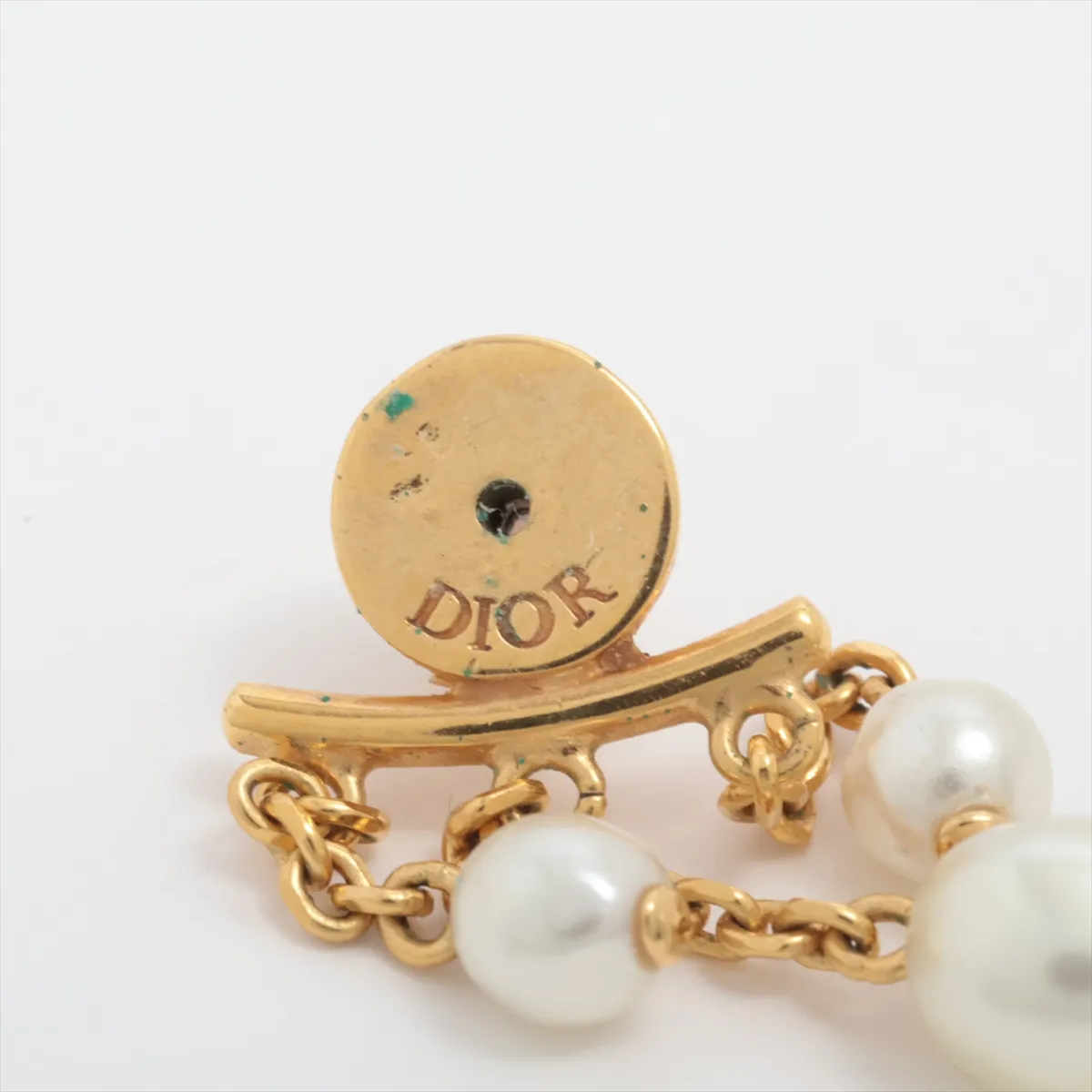 CD Navy earrings (for both ears), gold-plated with rhinestones and faux pearls. Shows signs of wear including — view 5