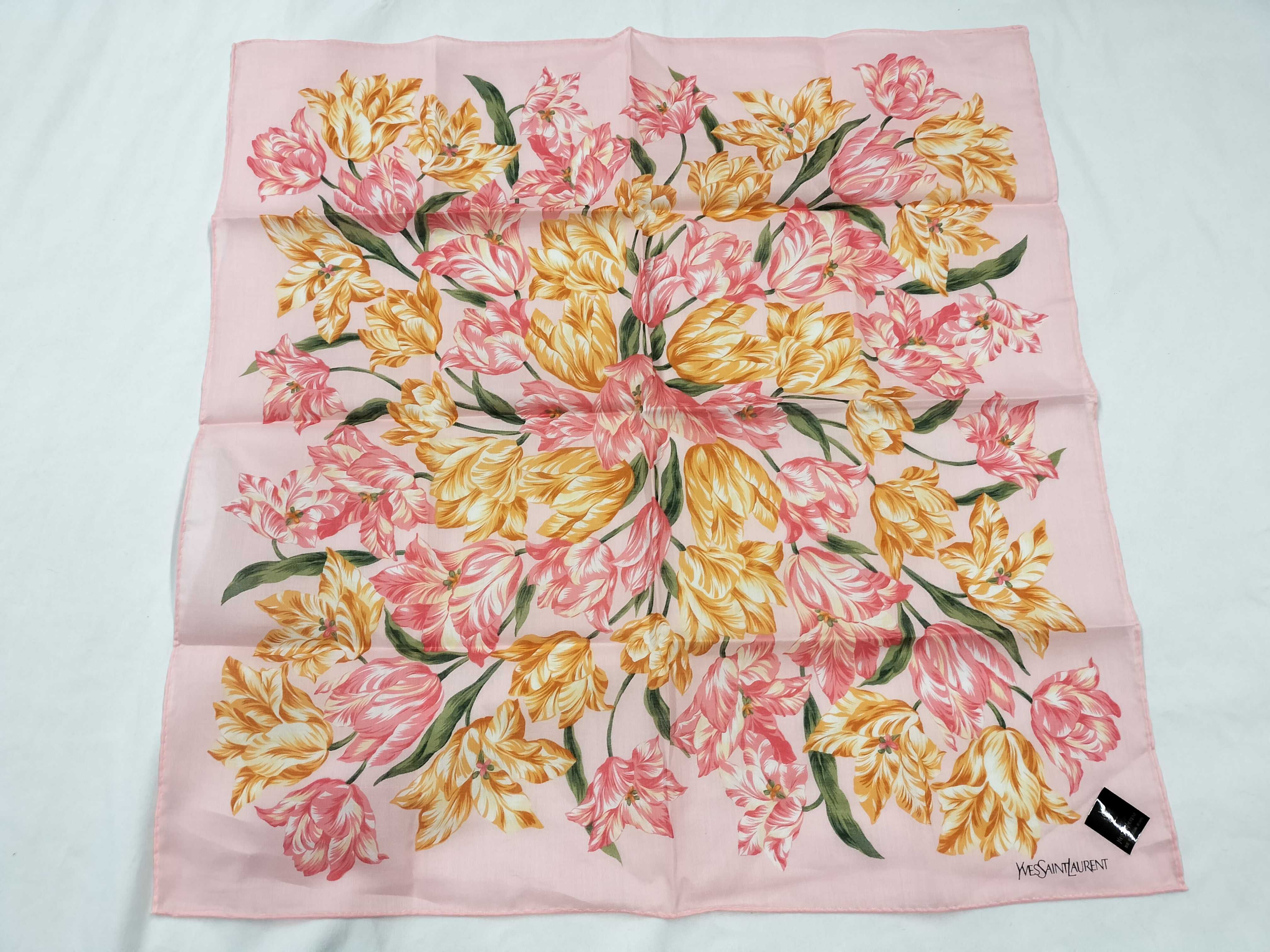 handkerchief/scarf with sticker, tulip design, pink, and other accessories.
