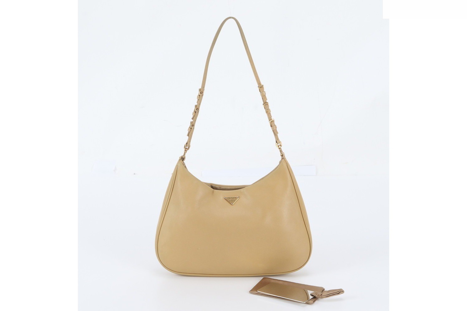 White tag included. Triangle logo leather shoulder bag.