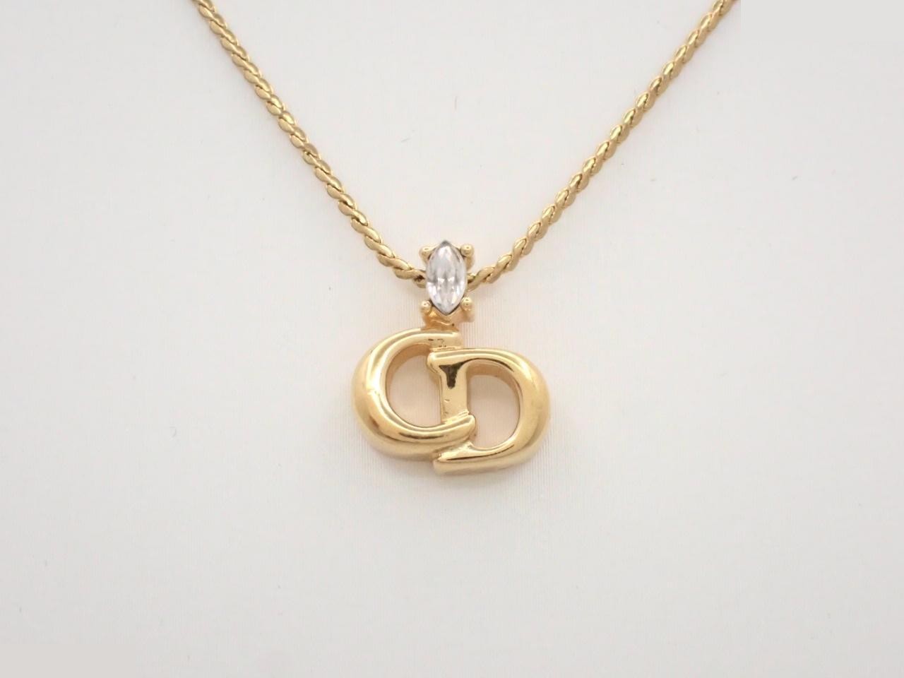 CD logo necklace/pendant, gold, with stone, neck circumference approximately 45cm.