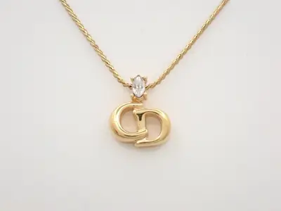 CD logo necklace/pendant, gold, with stone, neck circumference approximately 45cm.