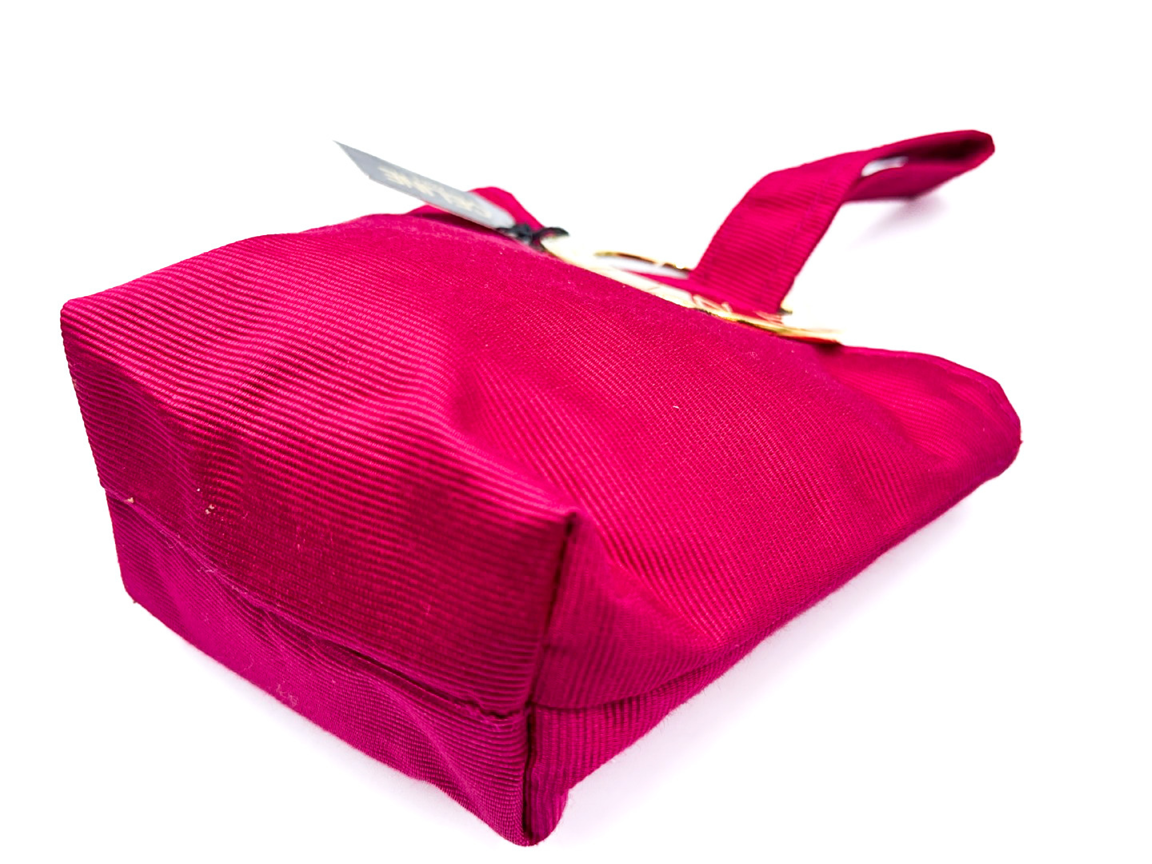 pink handbag with circle clasp and gold hardware, with tags. — view 6
